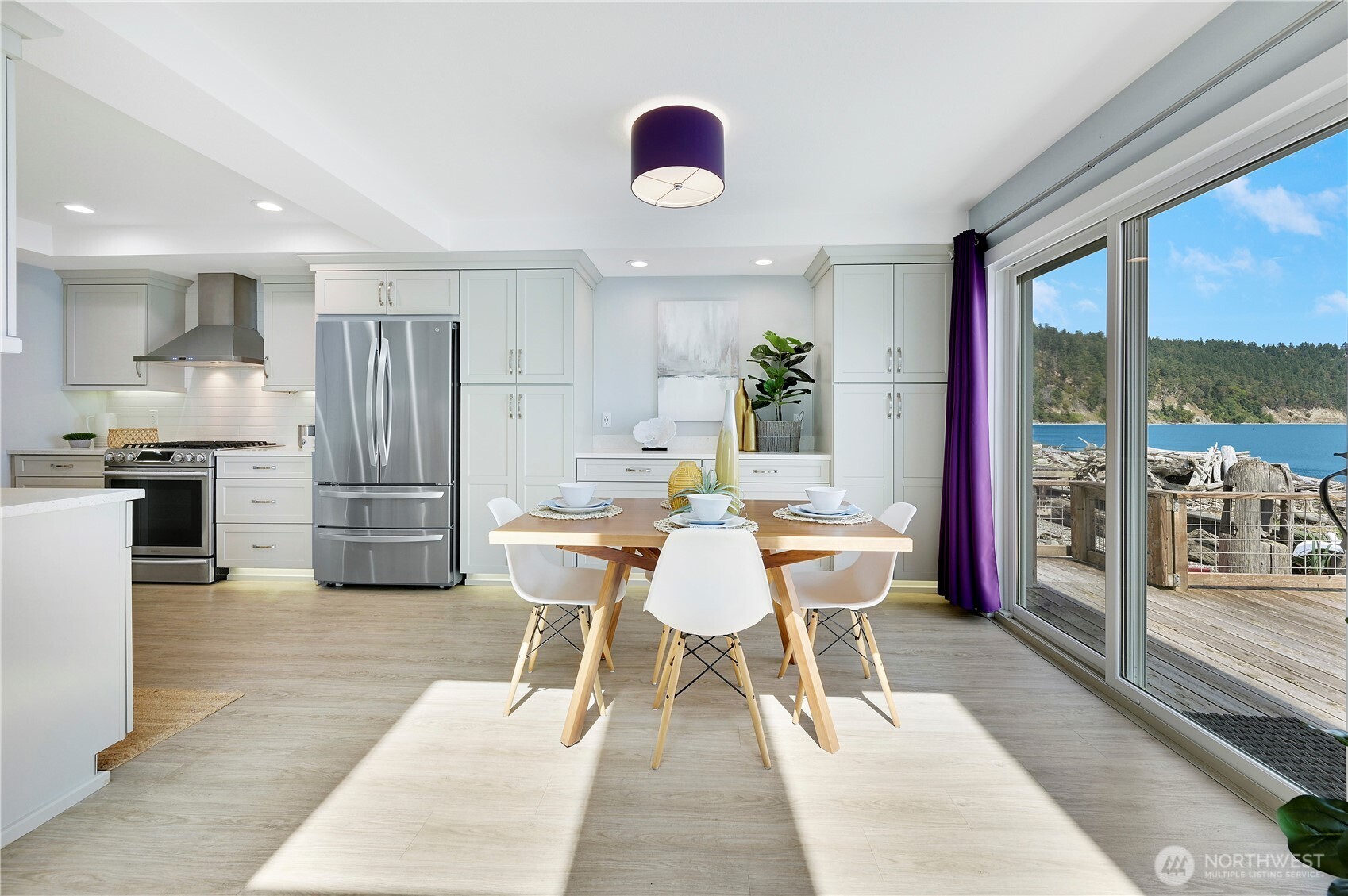 950 Beckett Point Road Port Townsend, WA 98368 - Photo 4 of 37 a dining room with furniture and a floor to ceiling window