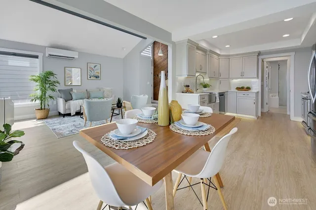 a dining room with furniture and wooden floor