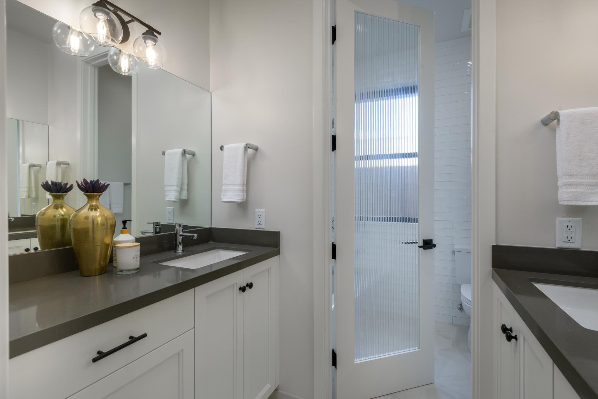 229 Mohawk Road Santa Barbara, CA 93109 - Photo 15 of 24 a bathroom with a granite countertop sink a toilet and shower