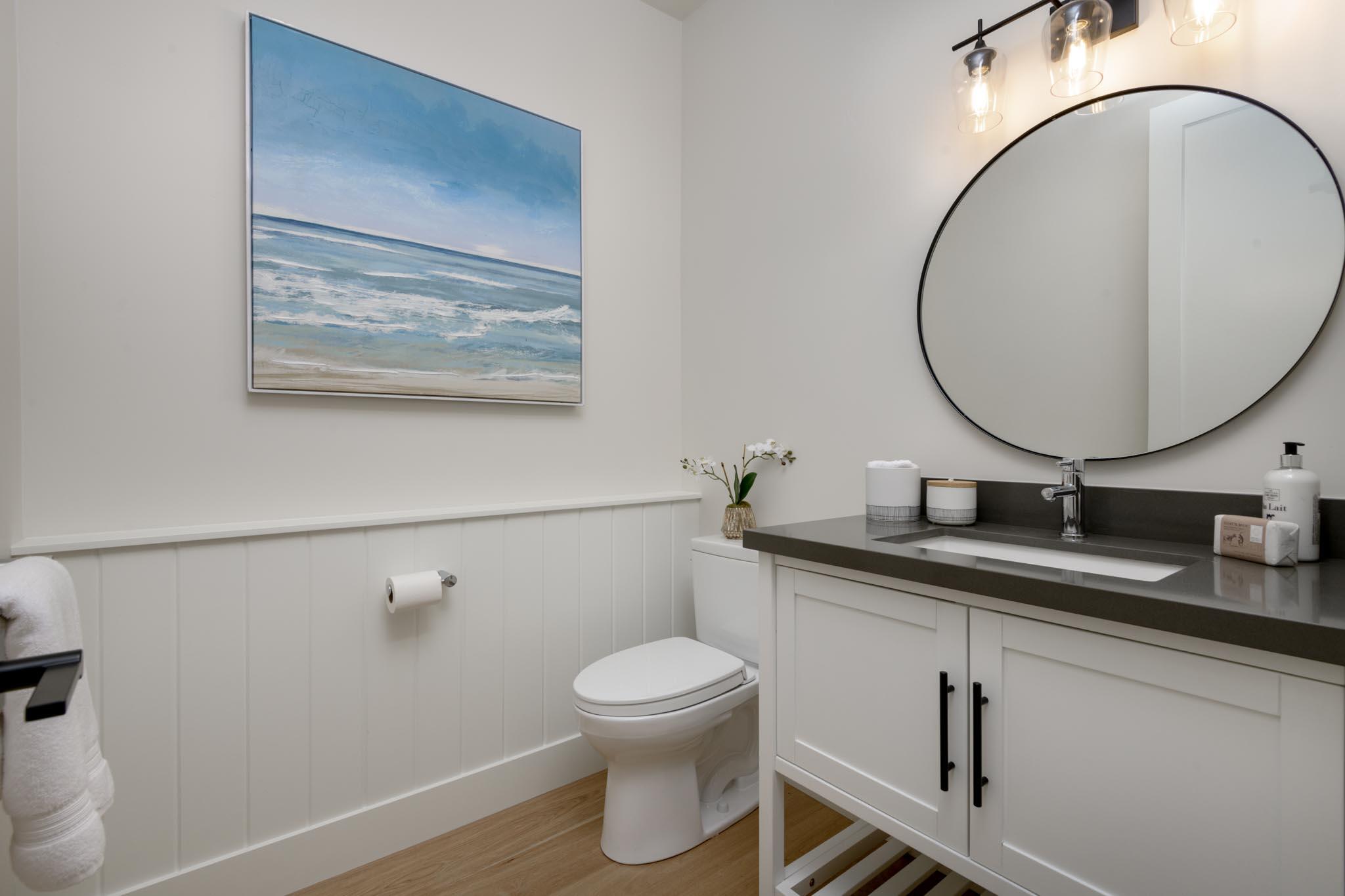 229 Mohawk Road Santa Barbara, CA 93109 - Photo 16 of 24 a bathroom with a toilet a sink and mirror