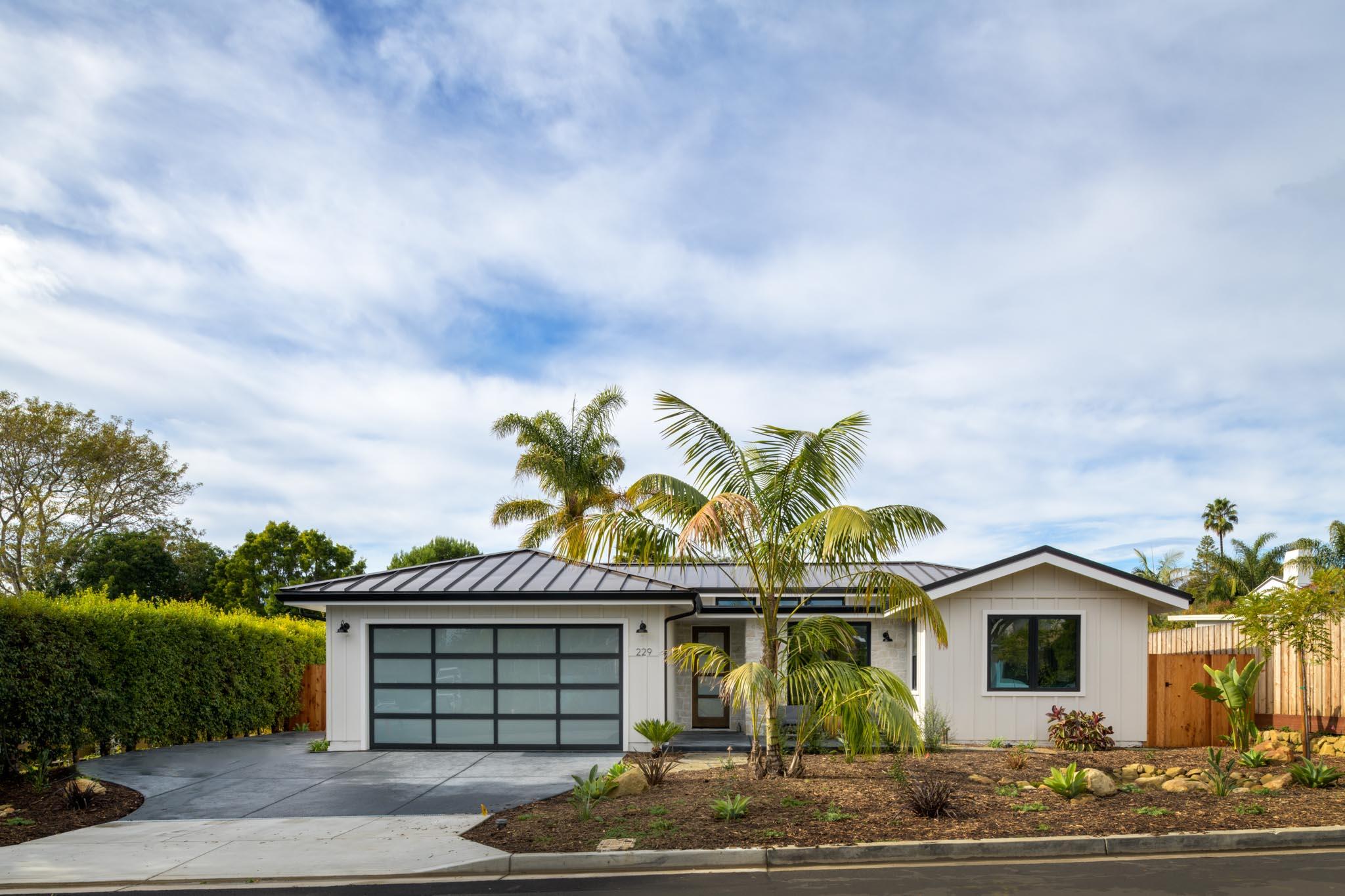 229 Mohawk Road Santa Barbara, CA 93109 - Photo 2 of 24 a front view of a house with a garden