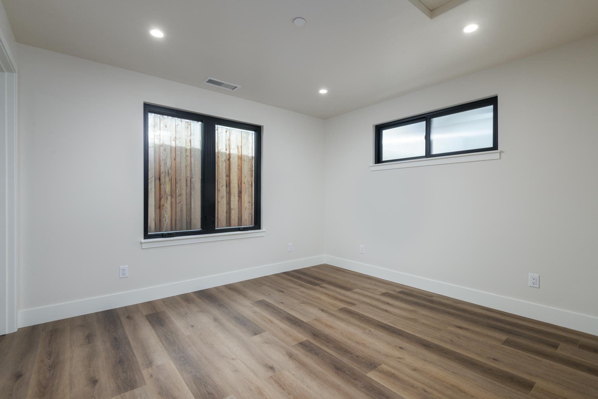 229 Mohawk Road Santa Barbara, CA 93109 - Photo 22 of 24 a view of an empty room with wooden floor and a window