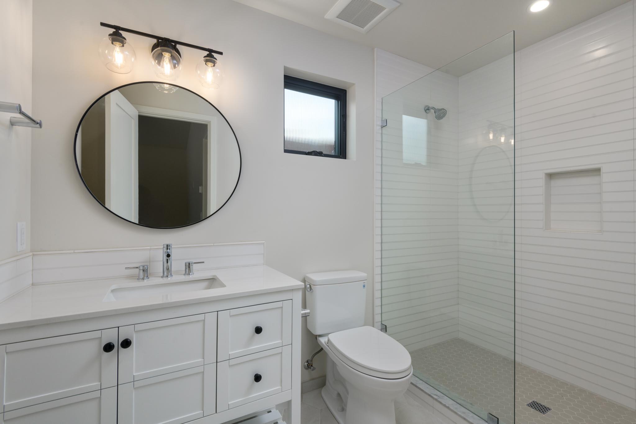 229 Mohawk Road Santa Barbara, CA 93109 - Photo 23 of 24 a bathroom with a toilet a sink and mirror