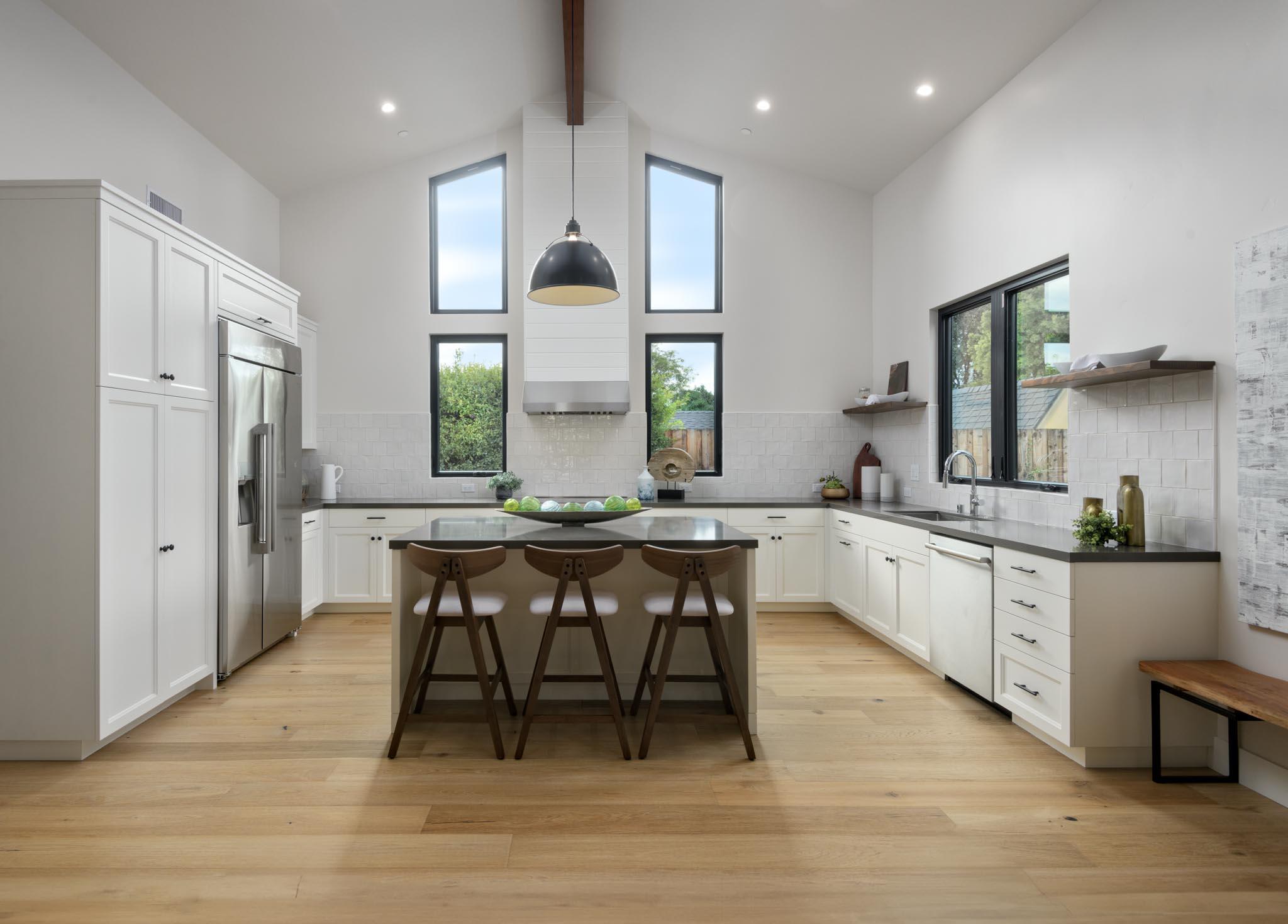 229 Mohawk Road Santa Barbara, CA 93109 - Photo 6 of 24 a large kitchen with a table and chairs in it