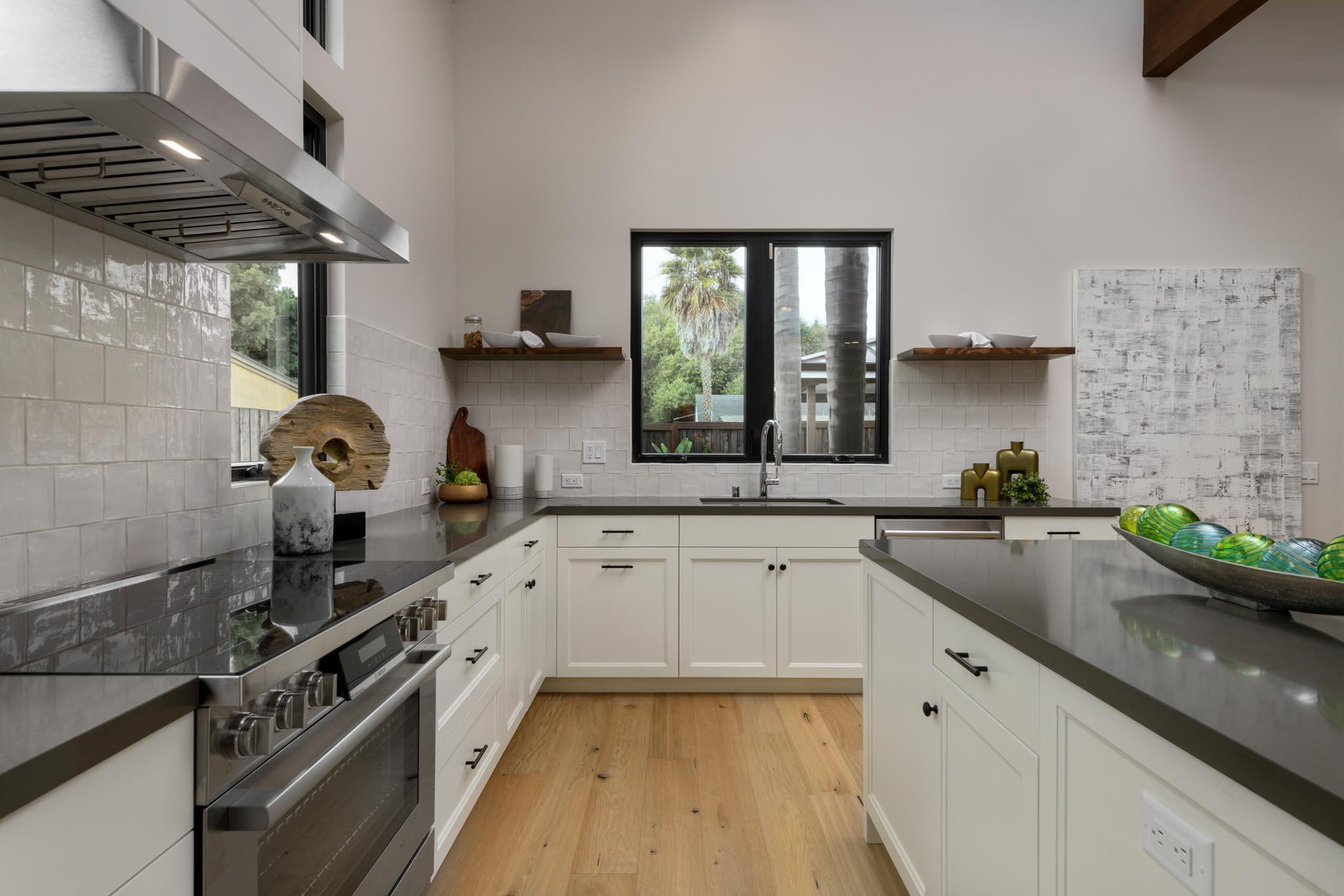 229 Mohawk Road Santa Barbara, CA 93109 - Photo 7 of 24 a kitchen with granite countertop a sink stove and cabinets