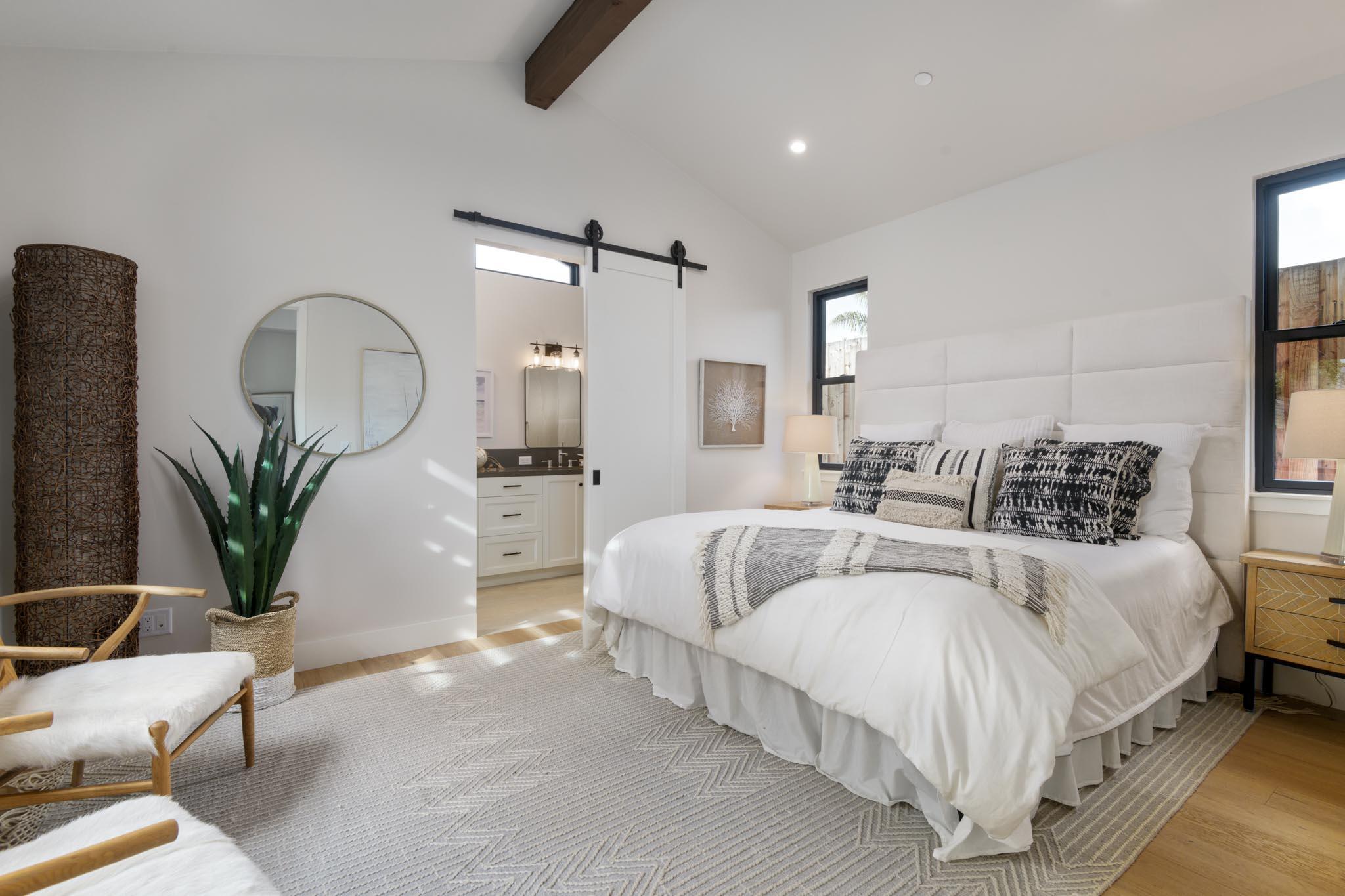 229 Mohawk Road Santa Barbara, CA 93109 - Photo 9 of 24 a bedroom with bed and a potted plant