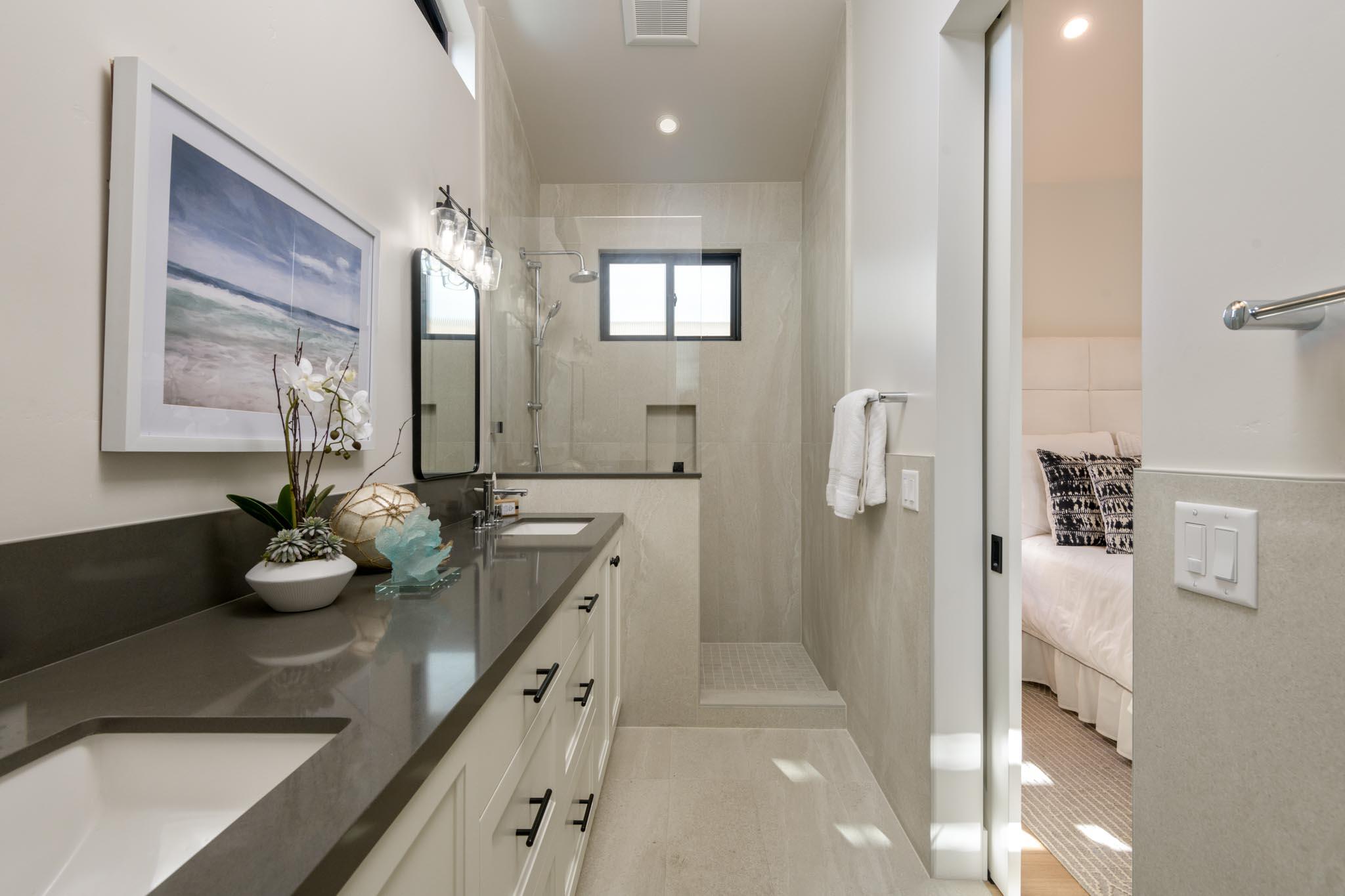 229 Mohawk Road Santa Barbara, CA 93109 - Photo 10 of 24 a bathroom with a double vanity sink mirror and shower