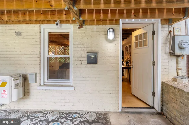 a sitting area with furniture and wooden deck