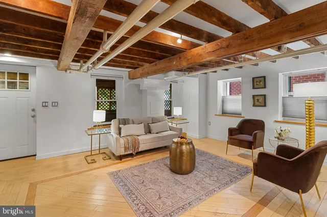 a kitchen with a sink a counter top space and stainless steel appliances