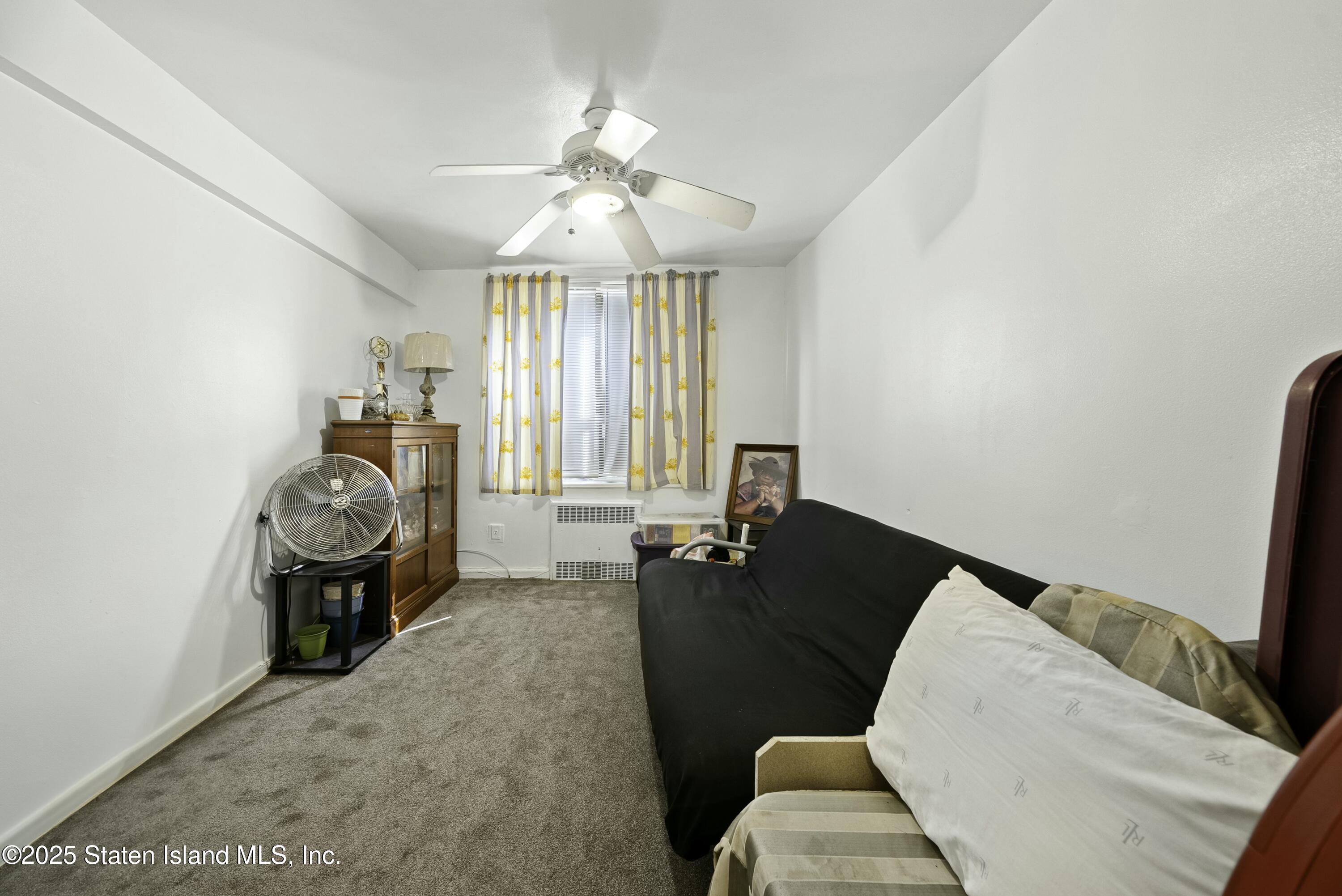 3105 Ave V, Unit 1F Brooklyn, NY 11229 - Photo 11 of 19 a living room with furniture and a chandelier