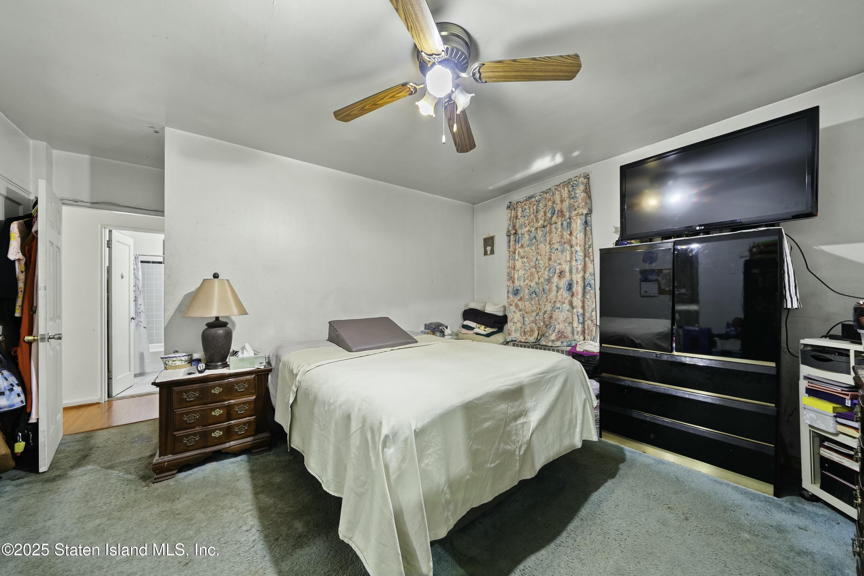 3105 Ave V, Unit 1F Brooklyn, NY 11229 - Photo 12 of 19 a bedroom with a bed and a chandelier