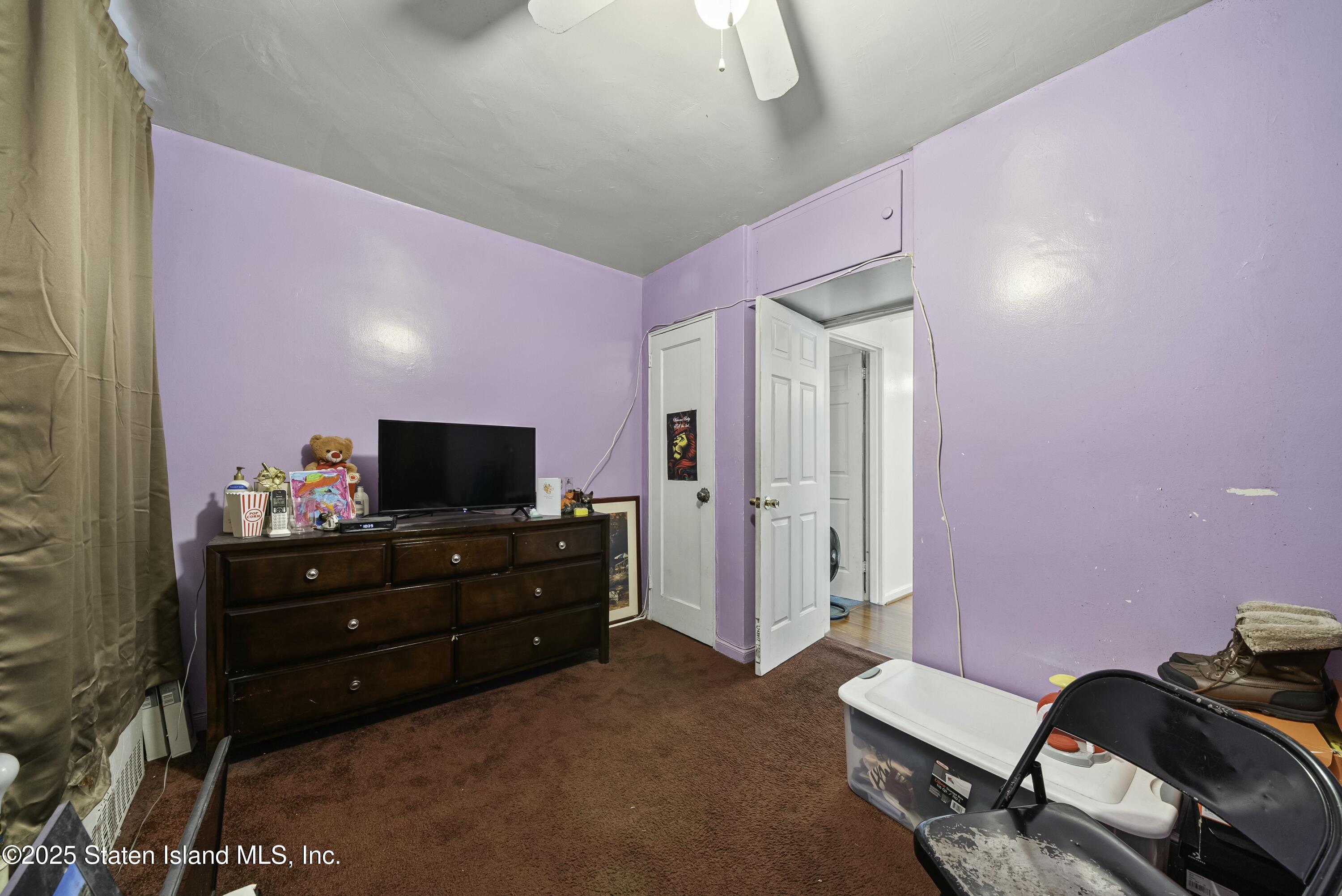 3105 Ave V, Unit 1F Brooklyn, NY 11229 - Photo 13 of 19 a room with furniture and flat screen tv