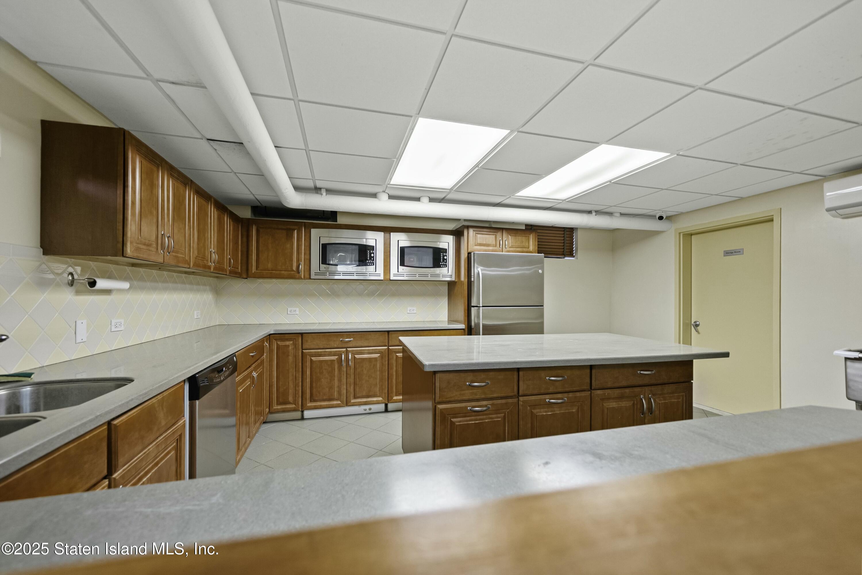 3105 Ave V, Unit 1F Brooklyn, NY 11229 - Photo 15 of 19 a kitchen with stainless steel appliances granite countertop a sink and cabinets