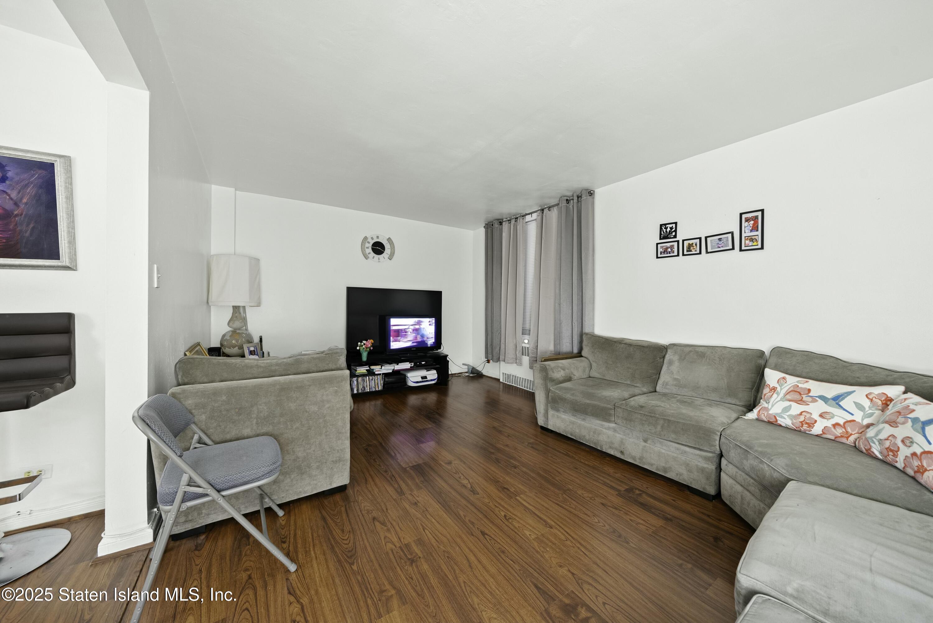 3105 Ave V, Unit 1F Brooklyn, NY 11229 - Photo 5 of 19 a living room with furniture and a flat screen tv