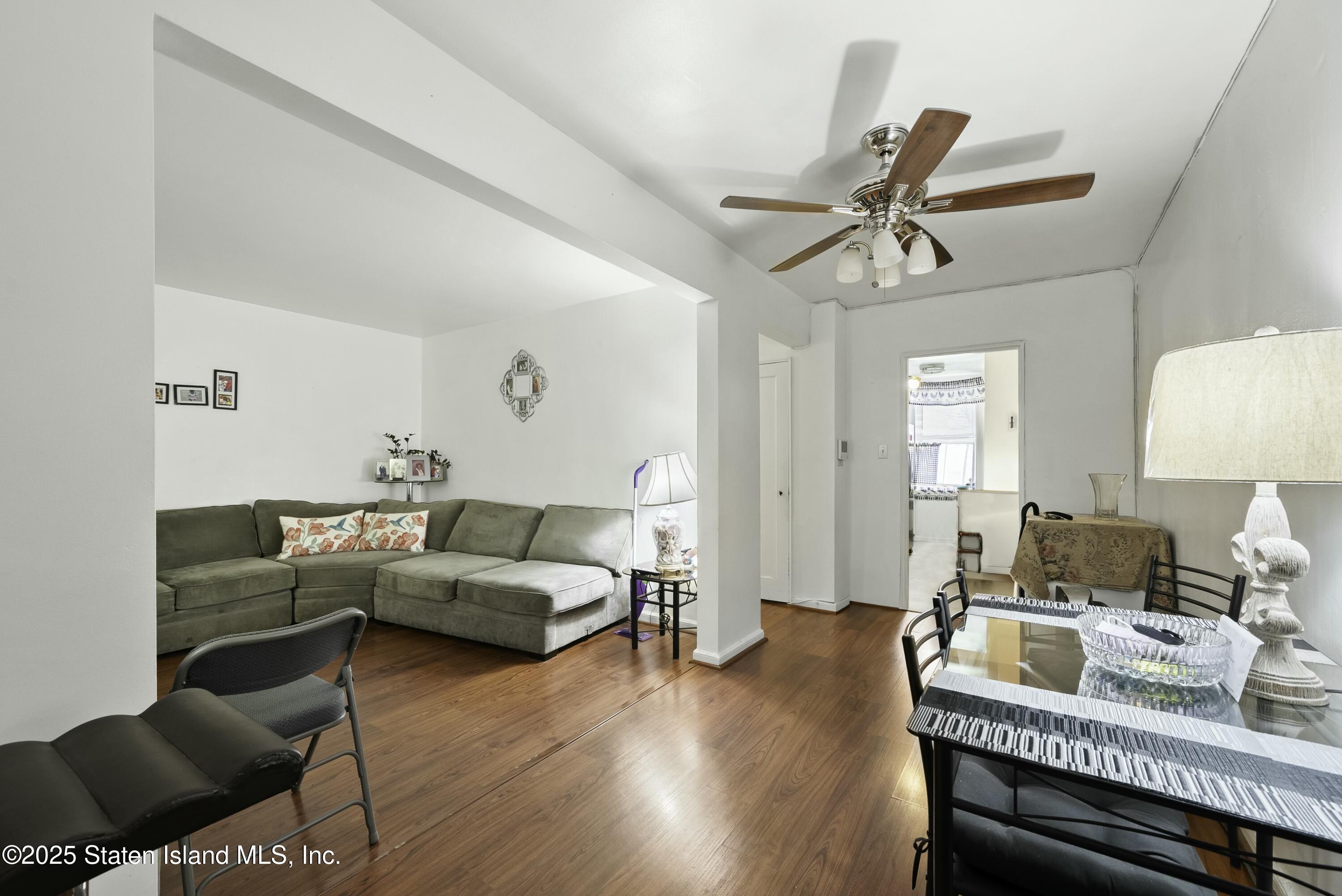 3105 Ave V, Unit 1F Brooklyn, NY 11229 - Photo 6 of 19 a living room with furniture and a wooden floor