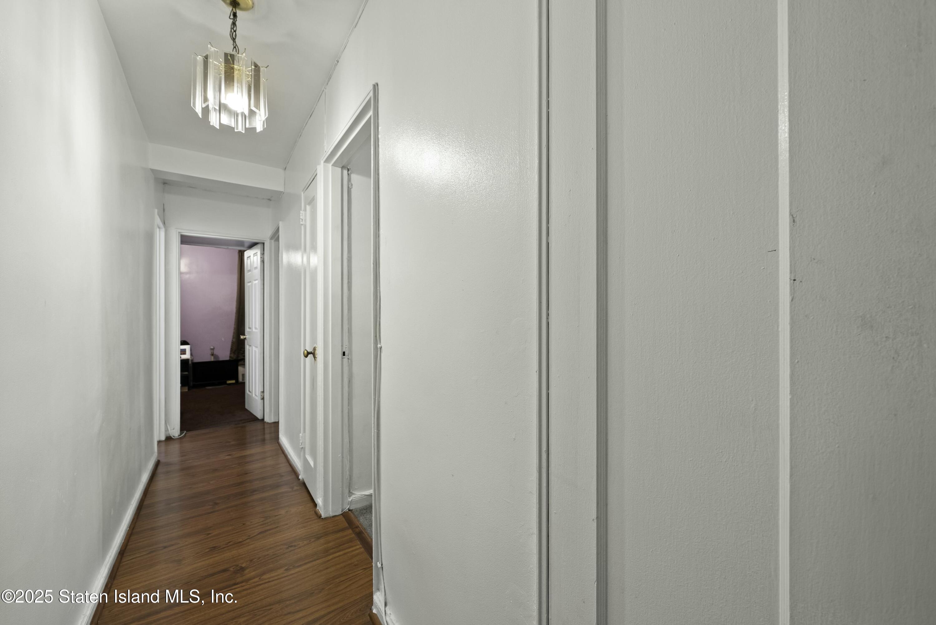 3105 Ave V, Unit 1F Brooklyn, NY 11229 - Photo 9 of 19 a view of a hallway with wooden floor and a hallway