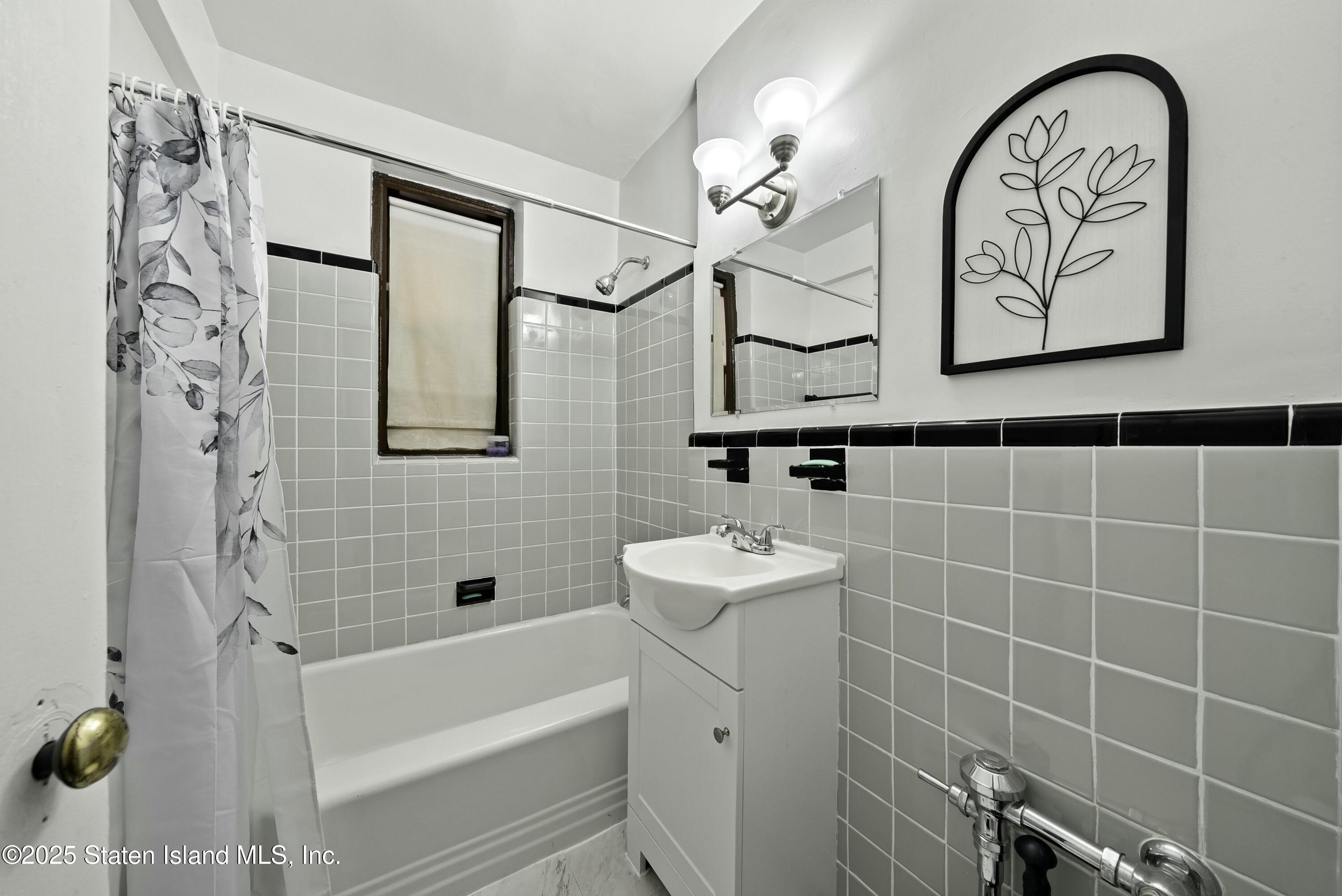 3105 Ave V, Unit 1F Brooklyn, NY 11229 - Photo 10 of 19 a bathroom with a bathtub and a shower