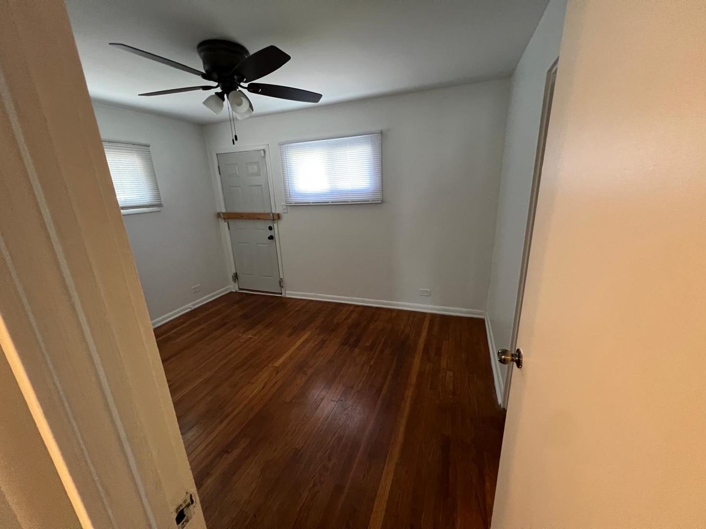 16442 Honore Avenue Markham, IL 60428 - Photo 9 of 16 a view of empty room with wooden floor