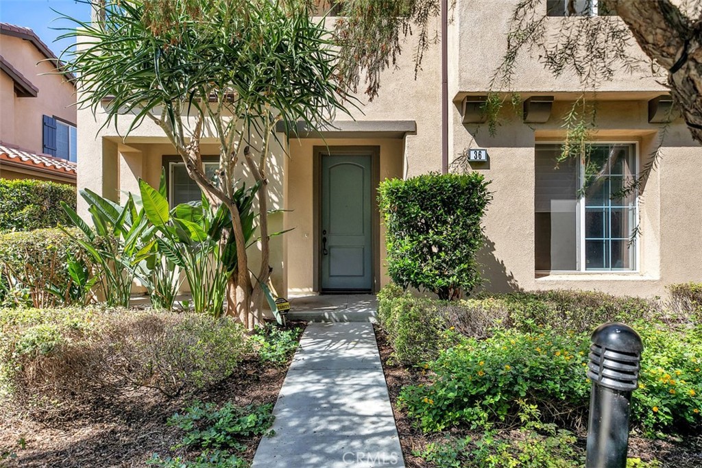 36 Shadowplay Irvine, CA 92620 - Photo 1 of 1 a front view of a house with a yard