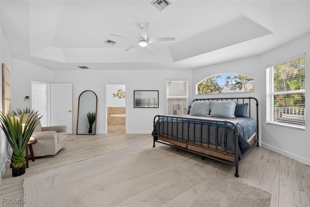 13570 Harbour Ridge Drive Fort Myers, FL 33908 - Photo 24 of 50 a spacious bedroom with a bed and a window