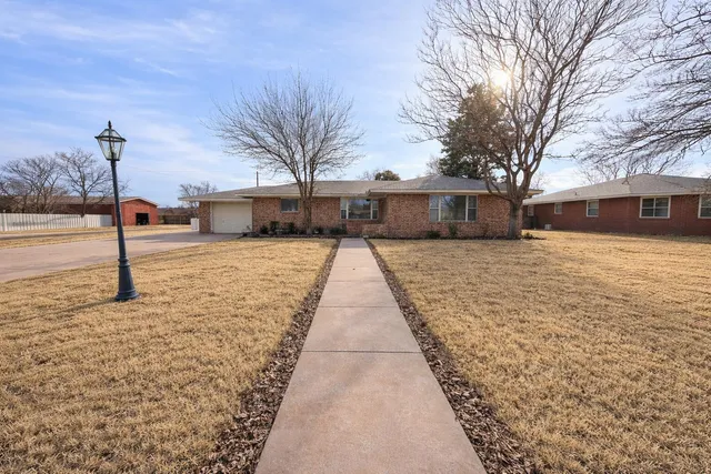 a view of a backyard of the house