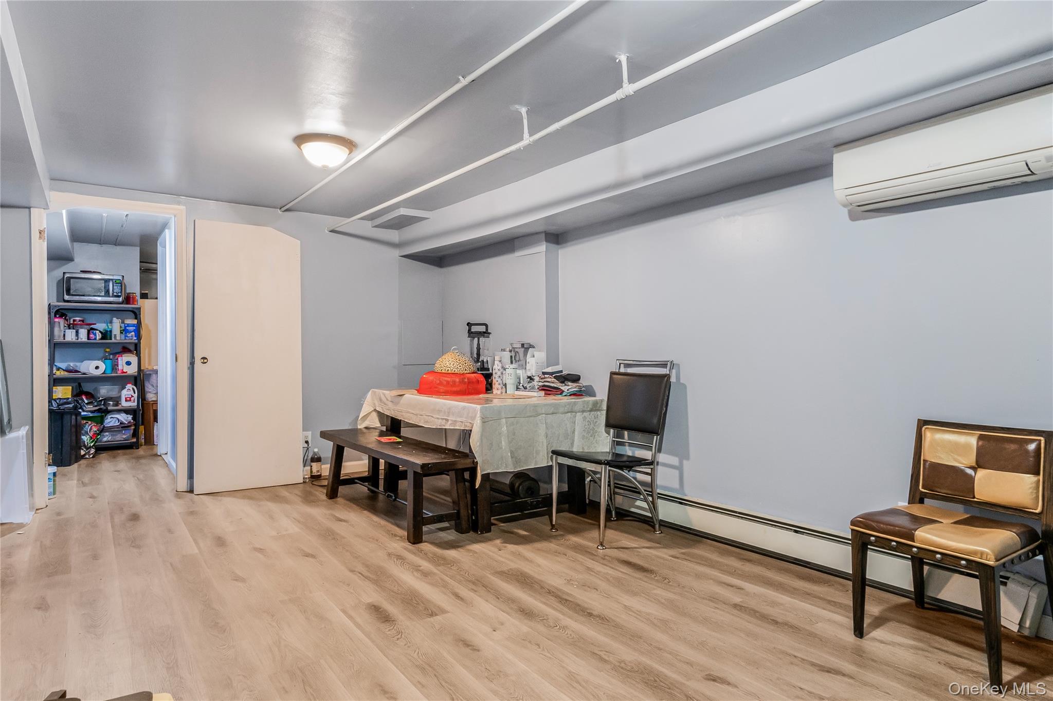 68 Riverdale Road Valley Stream, NY 11581 - Photo 13 of 19 a bedroom with furniture and a wooden floor