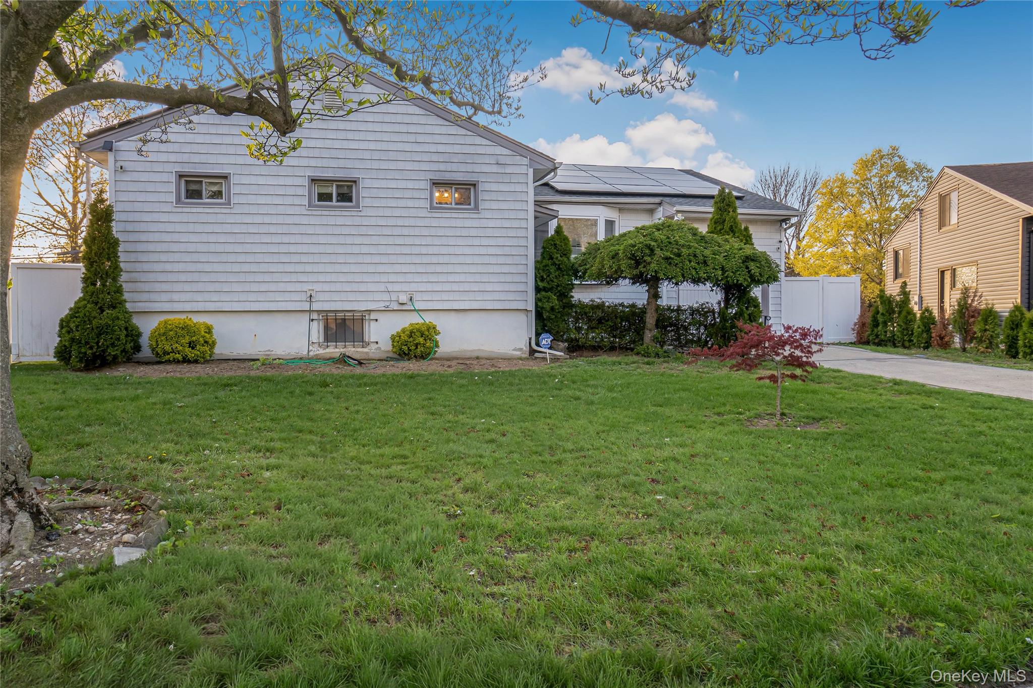 68 Riverdale Road Valley Stream, NY 11581 - Photo 18 of 19 a front view of a house with garden