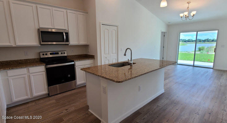604 Corbin Circle Southwest Palm Bay, FL 32908 - Photo 25 of 29 Lot 112B Kitchen-Dining Area
