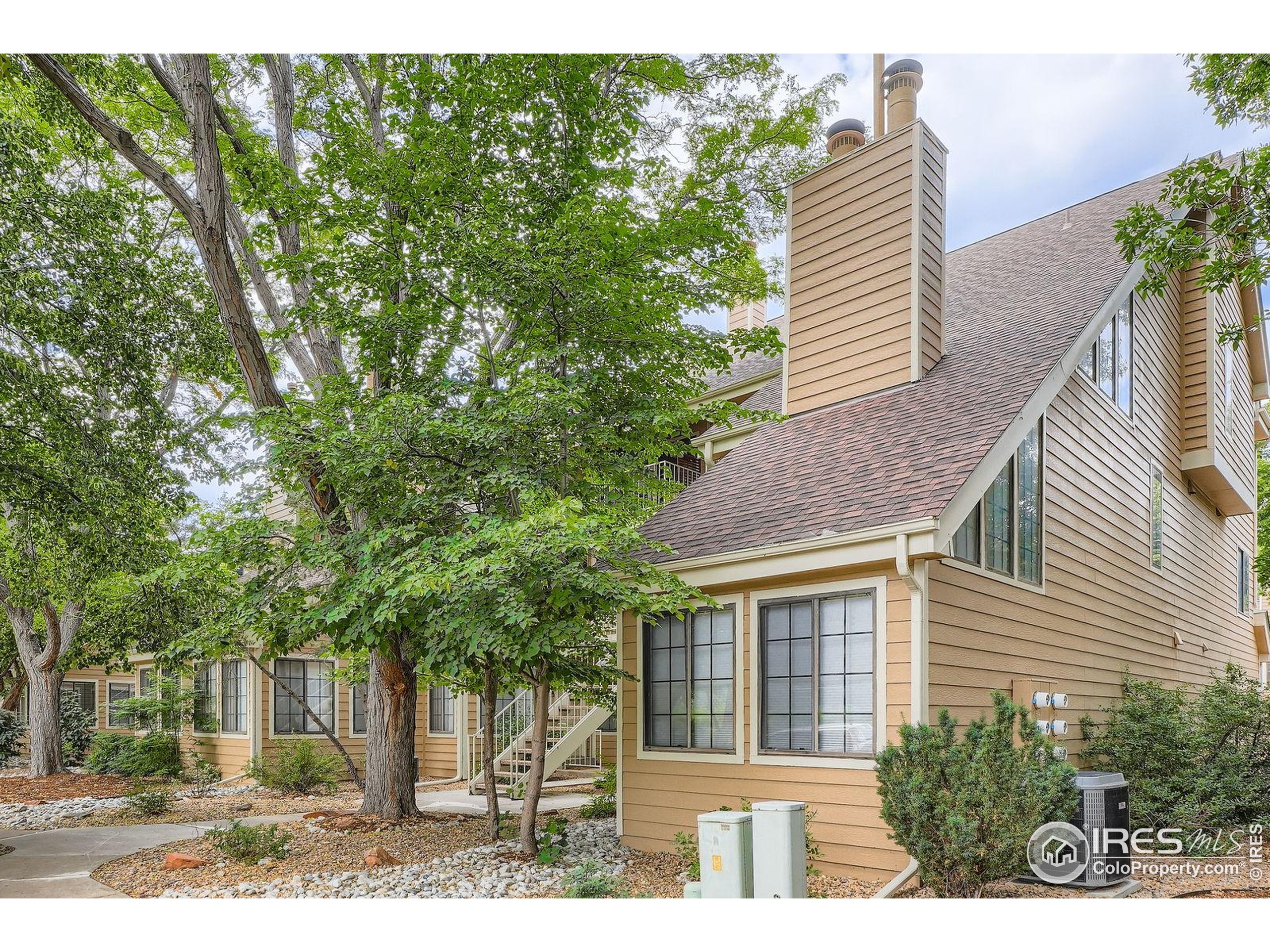 4767 White Rock Circle, Unit D Boulder, CO 80301 - Photo 1 of 41 a view of a house with a yard and potted plants