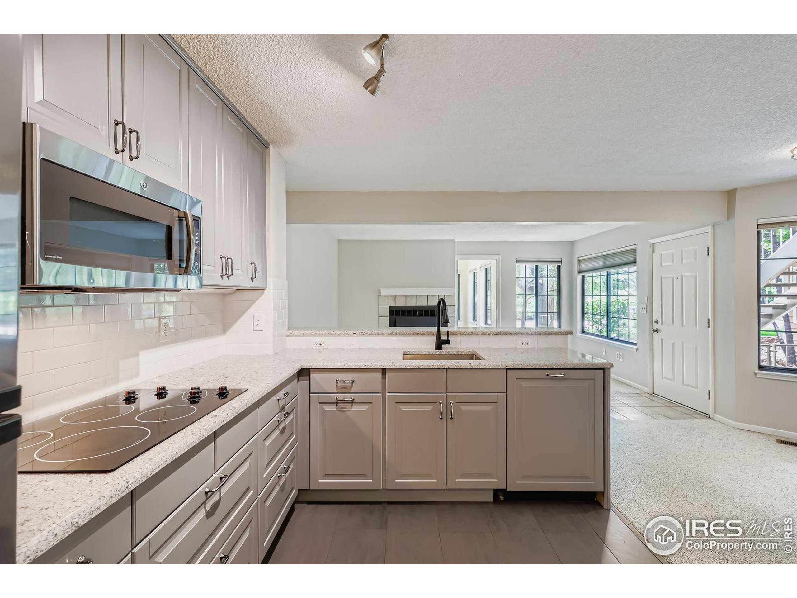 4767 White Rock Circle, Unit D Boulder, CO 80301 - Photo 17 of 41 a kitchen with a sink and cabinets
