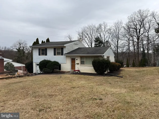 a view of a house with a snow in front of house