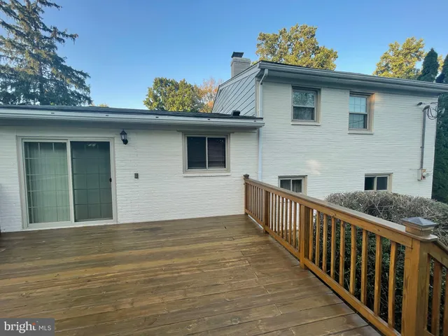 a front view of a house with deck
