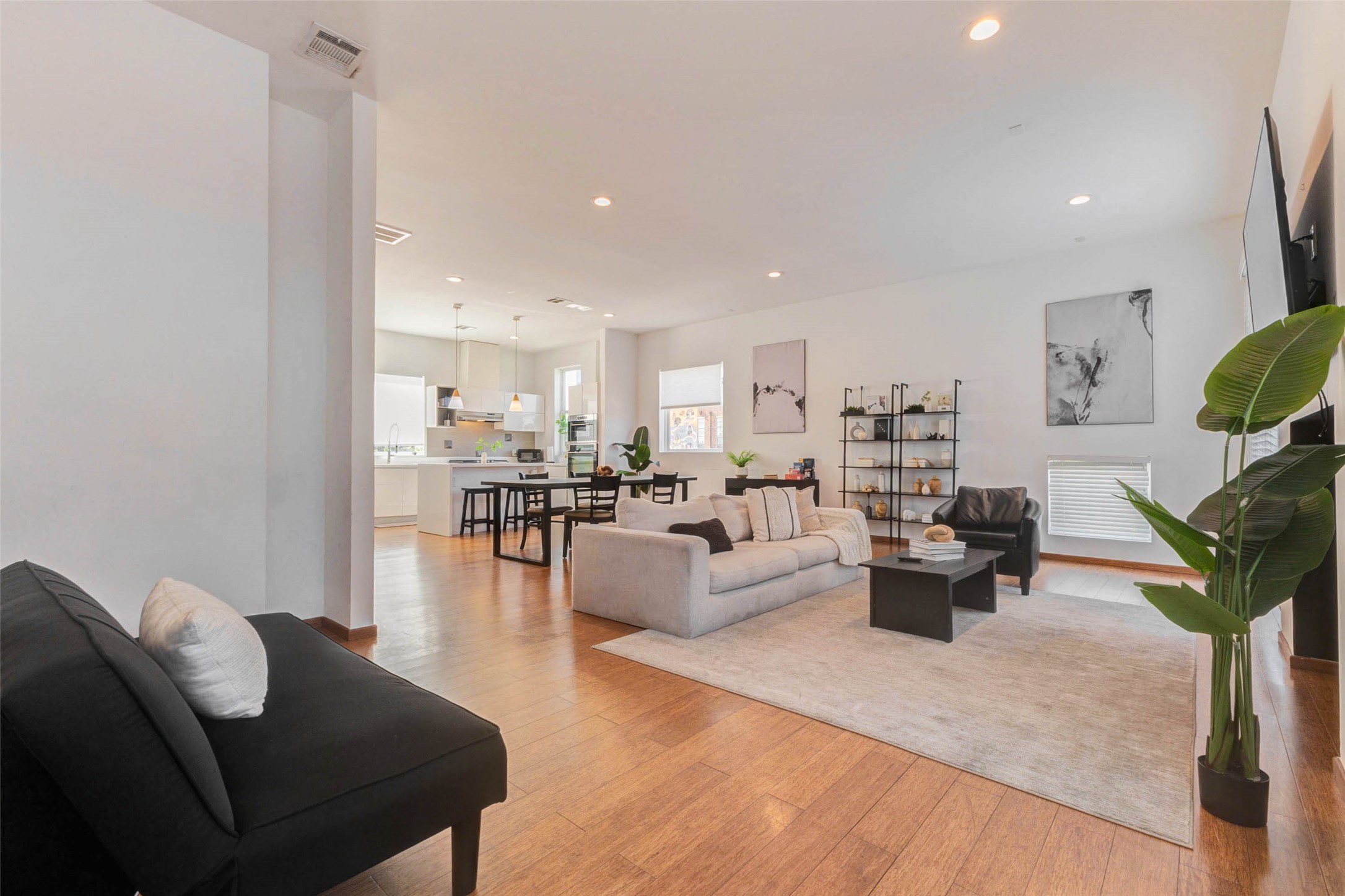 4115 Chartres Street Houston, TX 77004 - Photo 11 of 50 a living room with fireplace furniture and a wooden floor