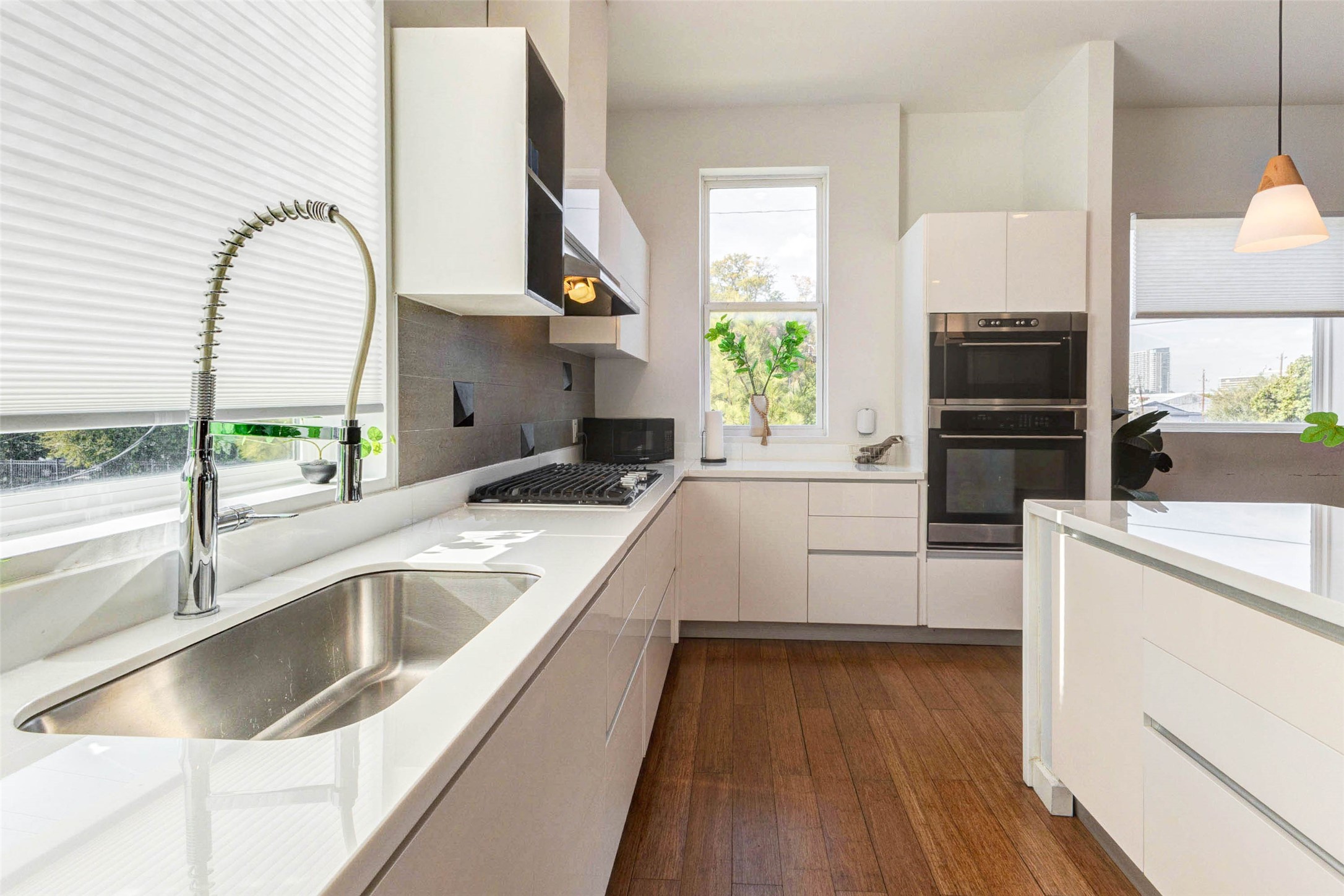 4115 Chartres Street Houston, TX 77004 - Photo 19 of 50 a kitchen with a sink cabinets and a large window