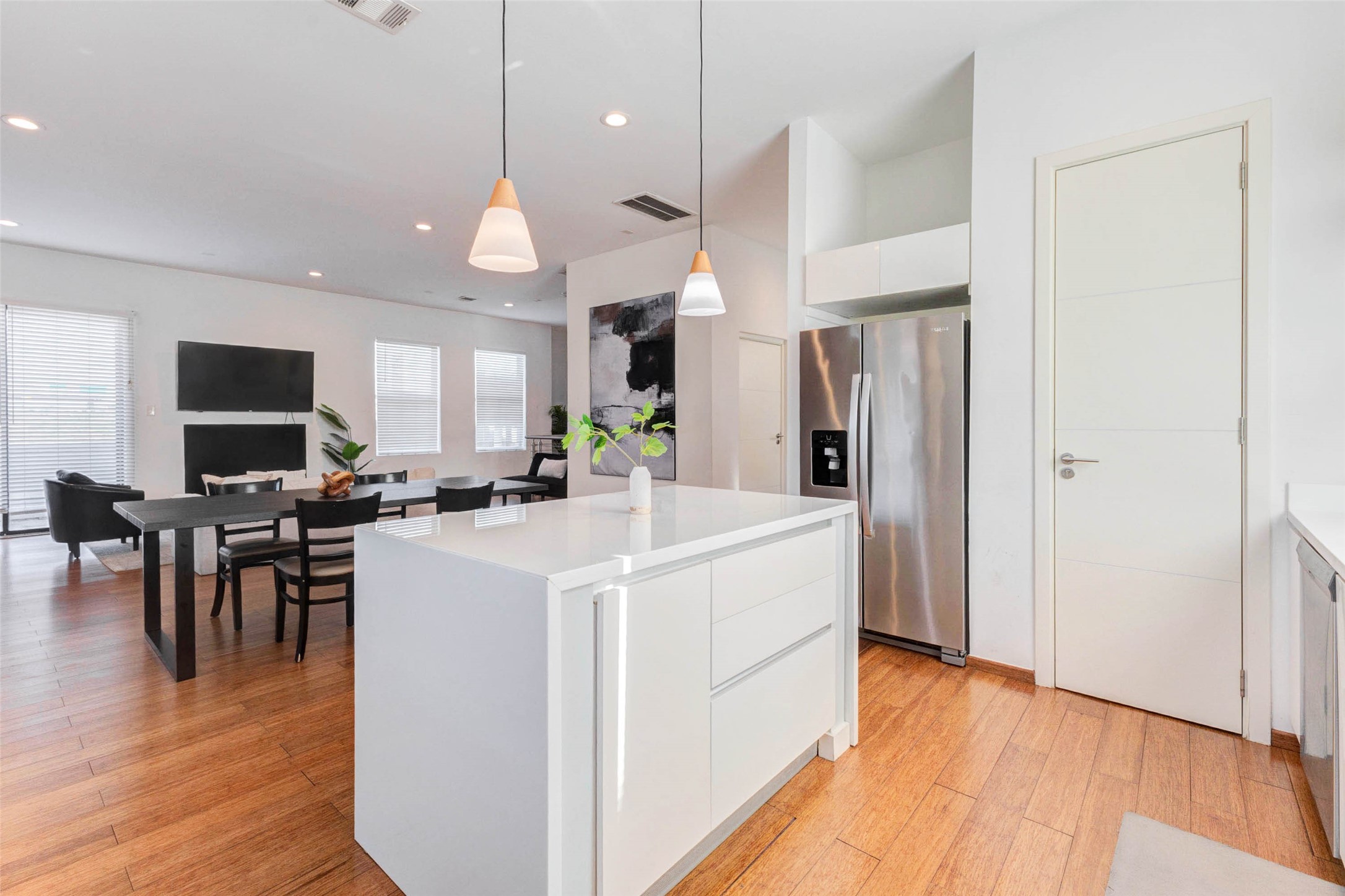4115 Chartres Street Houston, TX 77004 - Photo 21 of 50 a large kitchen with white cabinets and stainless steel appliances
