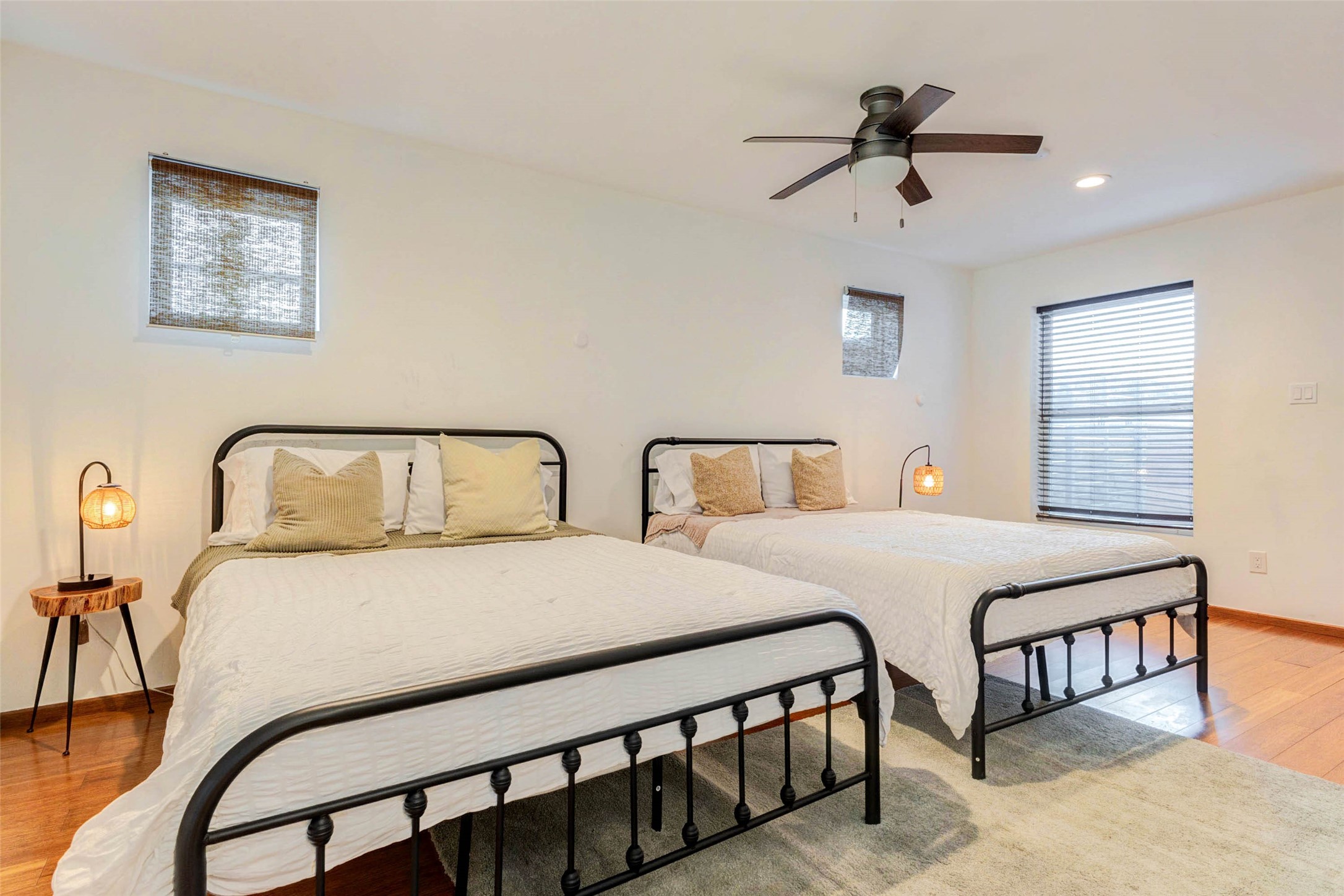4115 Chartres Street Houston, TX 77004 - Photo 26 of 50 a bedroom with two beds and a chandelier