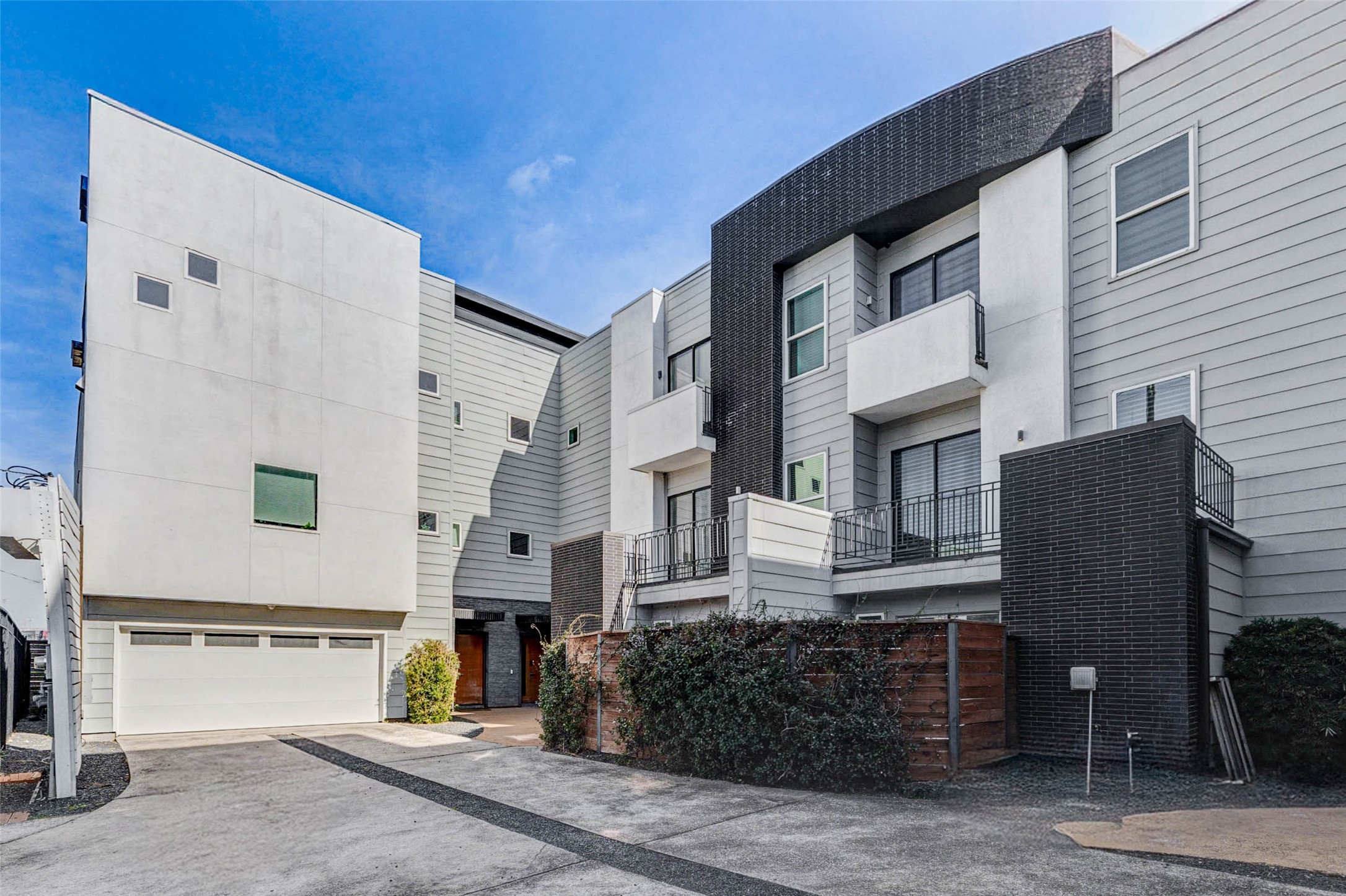 4115 Chartres Street Houston, TX 77004 - Photo 4 of 50 a front view of a house with a garden