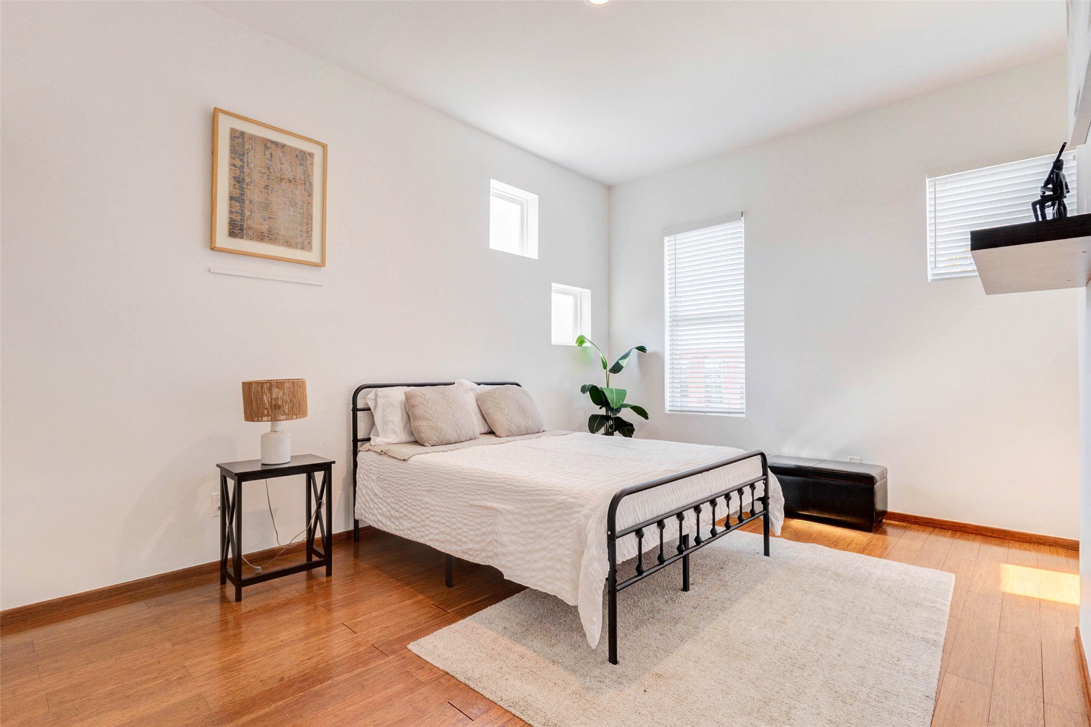 4115 Chartres Street Houston, TX 77004 - Photo 43 of 50 a bedroom with a bed table and a window