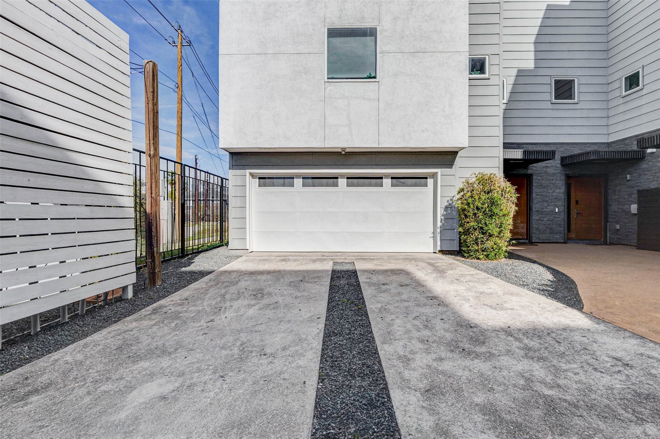 4115 Chartres Street Houston, TX 77004 - Photo 5 of 50 a front view of a house with a yard and garage