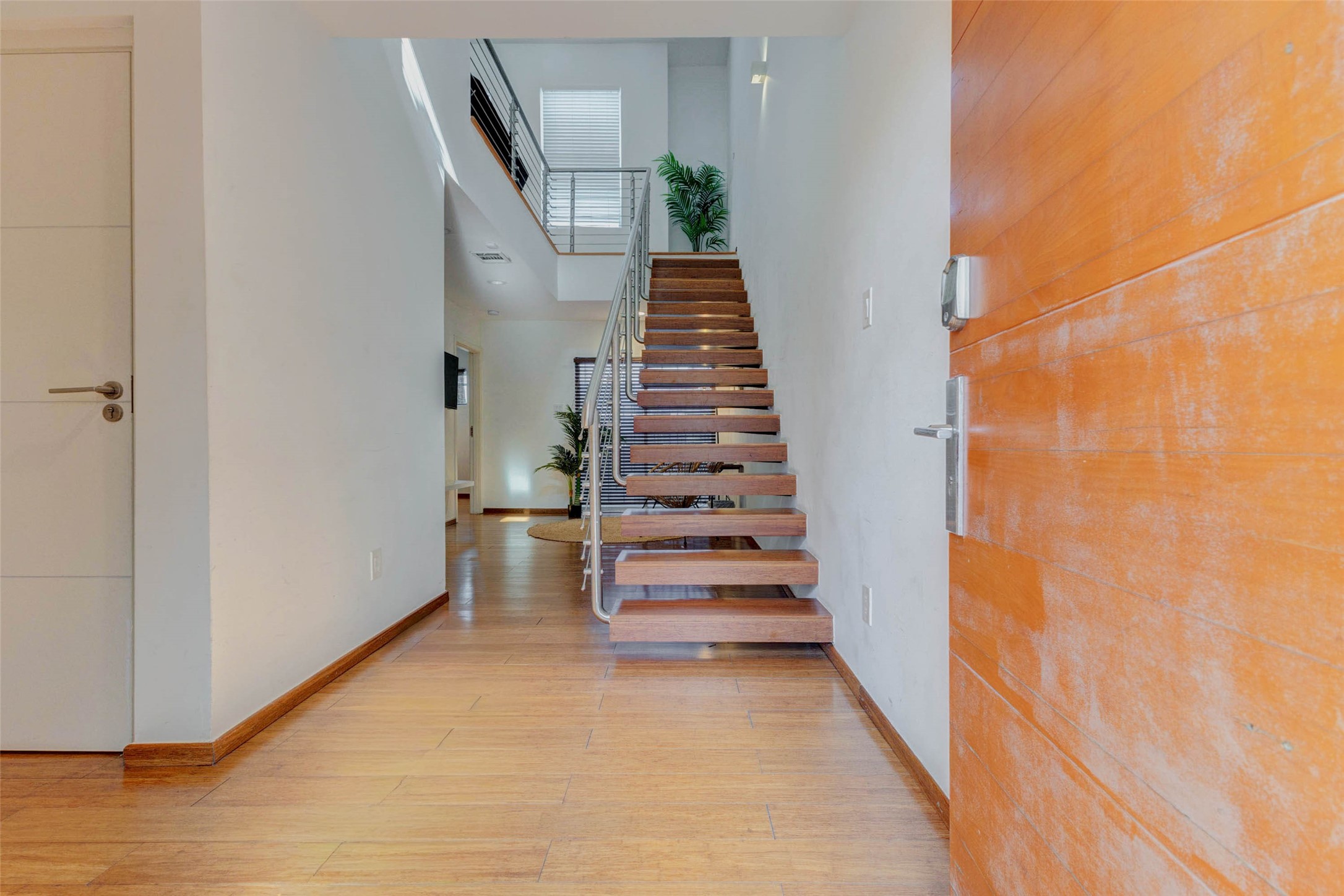 4115 Chartres Street Houston, TX 77004 - Photo 7 of 50 a view of entryway and hall with wooden floor
