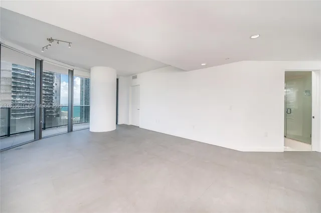 a kitchen with stainless steel appliances granite countertop a stove and cabinets