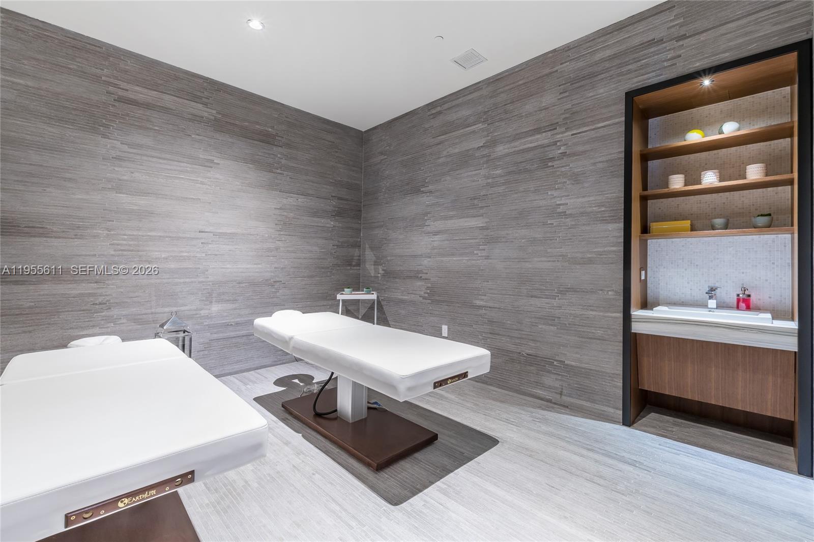 45 Southwest 9th Street, Unit 3401 Miami, FL 33130 - Photo 31 of 36 a bathroom with a sink and a mirror