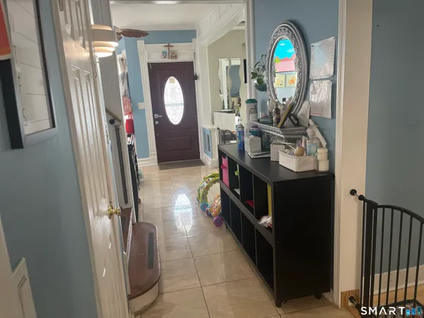 a view of a livingroom with furniture and a mirror