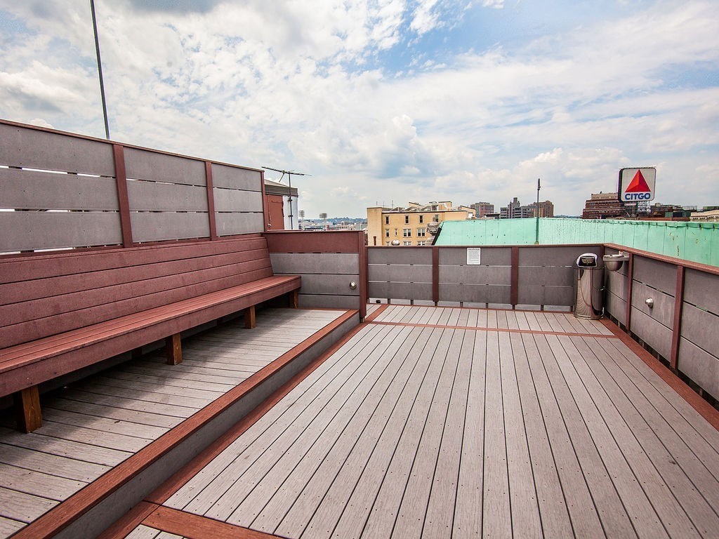 464 Commonwealth Avenue, Unit 36 Boston, MA 02215 - Photo 10 of 18 a view of roof deck with wooden floor and seating space