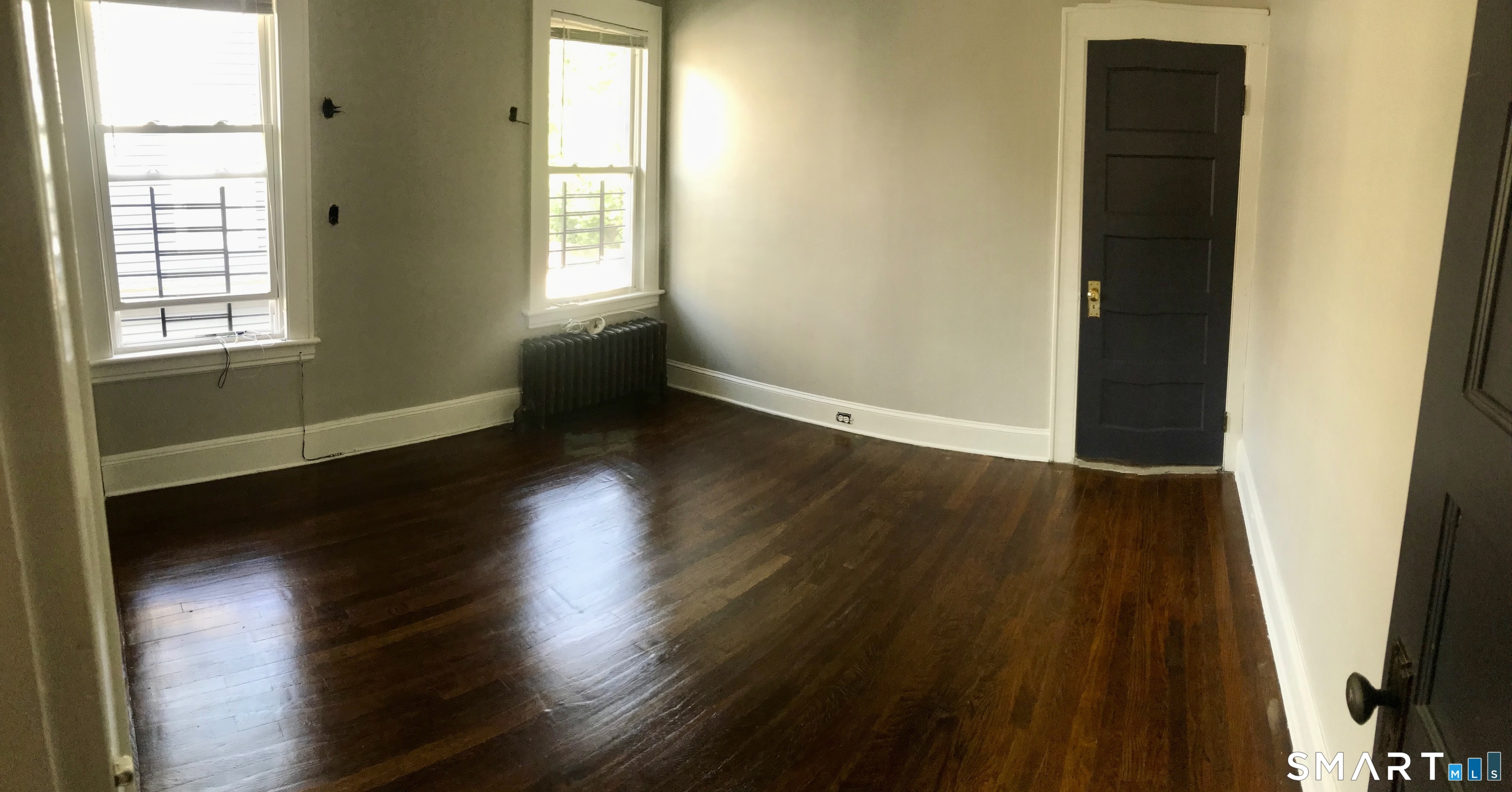52 Catherine Street Stratford, CT 06615 - Photo 15 of 19 a view of an empty room with wooden floor and a window