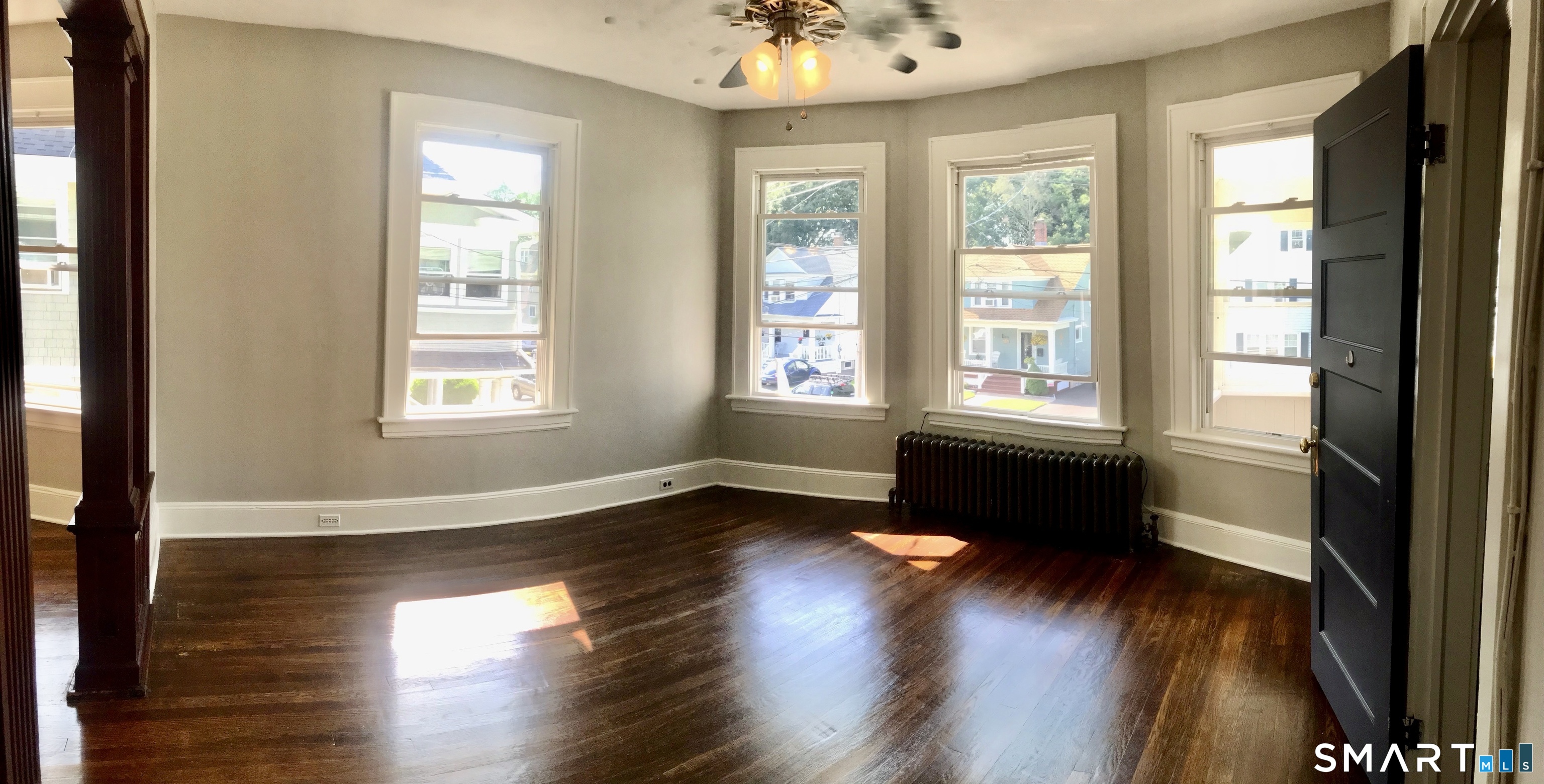 52 Catherine Street Stratford, CT 06615 - Photo 16 of 19 a view of an empty room with wooden floor and a window