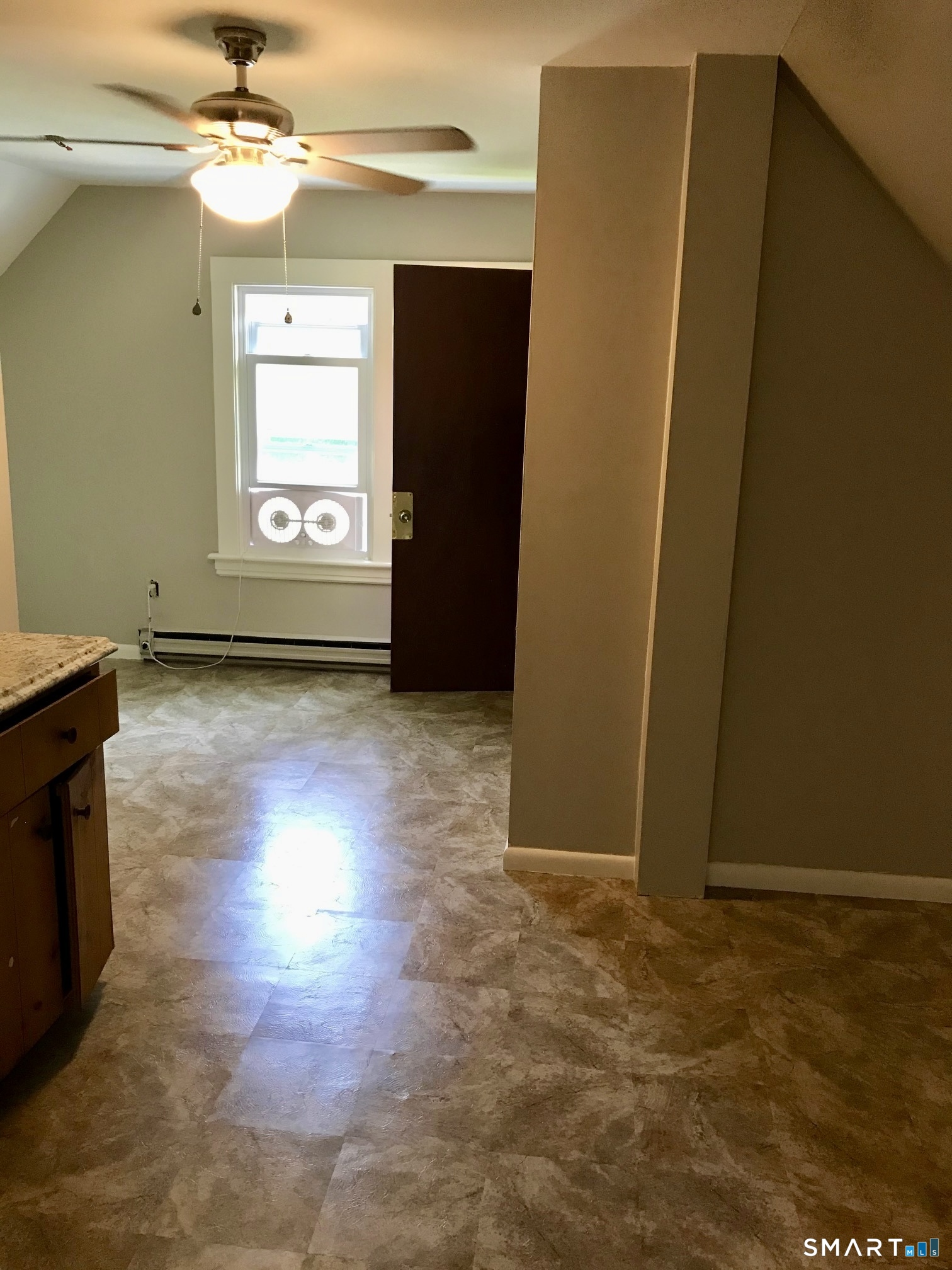 52 Catherine Street Stratford, CT 06615 - Photo 5 of 19 an empty room with windows and entrance