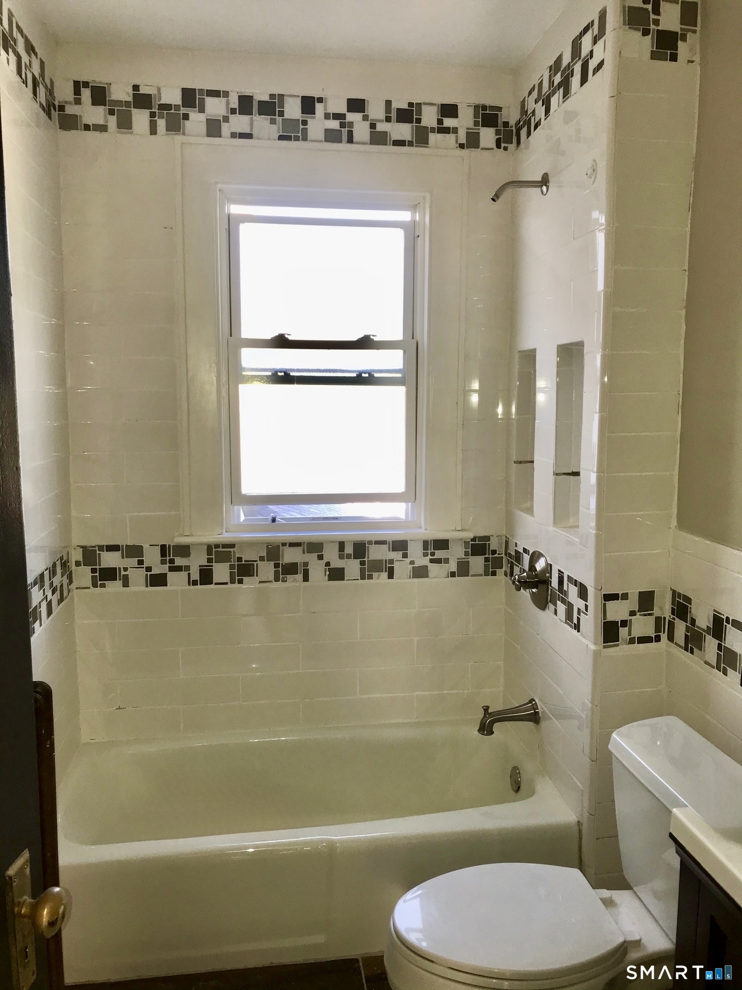 52 Catherine Street Stratford, CT 06615 - Photo 7 of 19 a bathroom with a toilet sink and shower
