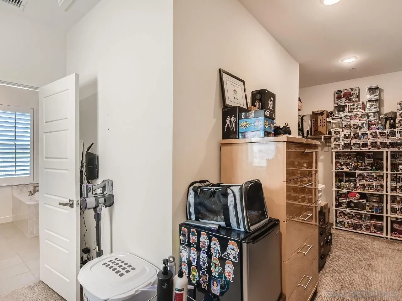 9069 West Bluff Place Santee, CA 92071 - Photo 20 of 45 a view of walk in closet with clothes and shoes