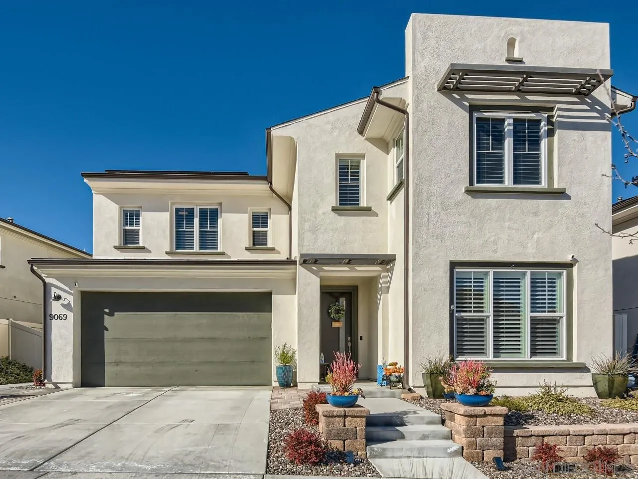 9069 West Bluff Place Santee, CA 92071 - Photo 2 of 45 a front view of a house with sitting area